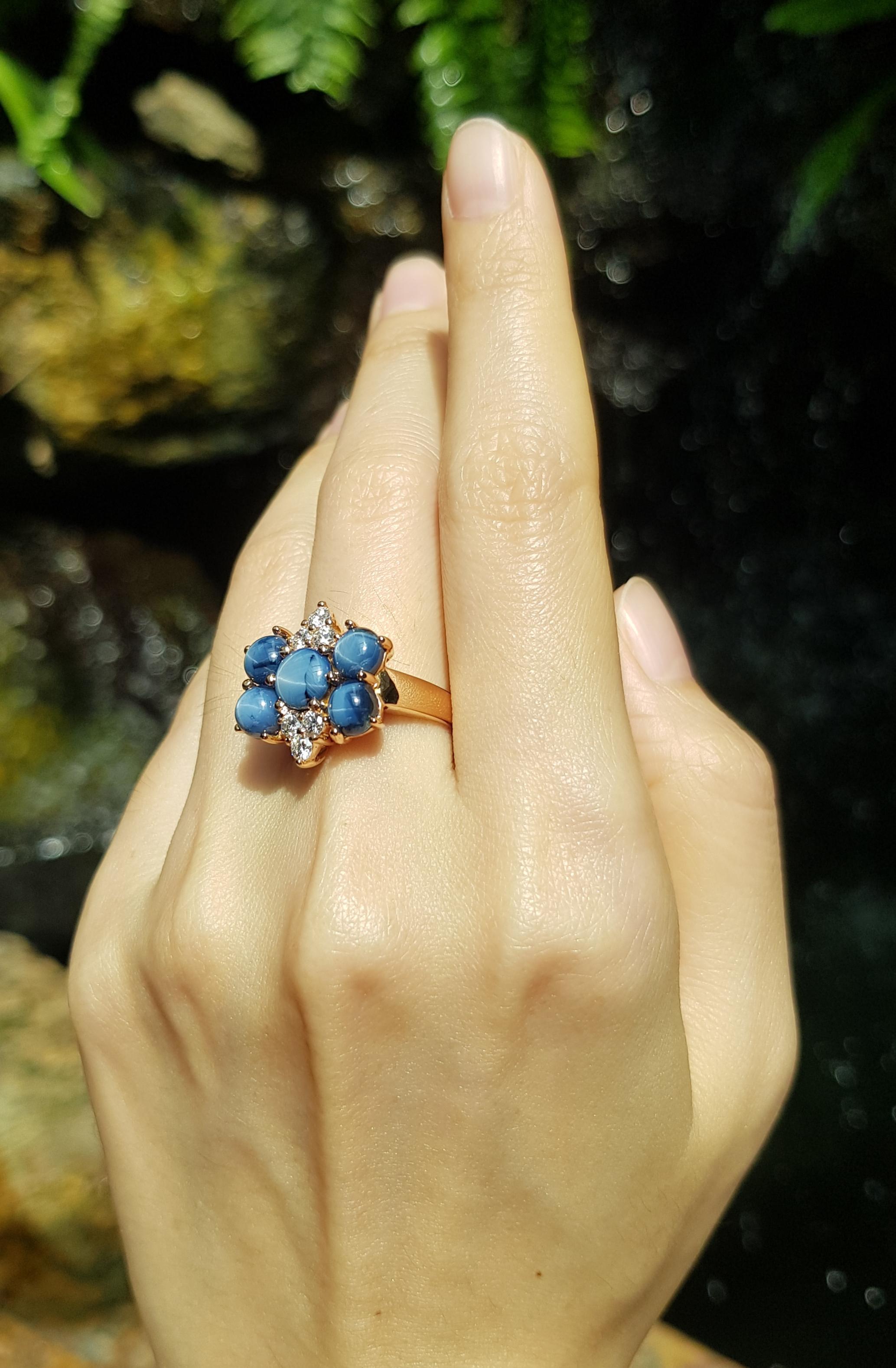 Contemporary Blue Star Sapphire with Diamond Ring Set in 18 Karat Rose Gold Settings For Sale