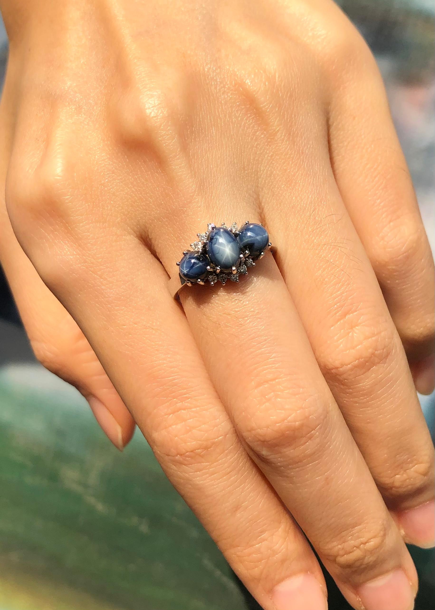 Contemporary Blue Star Sapphire with Diamond Ring Set in 18 Karat White Gold Settings For Sale