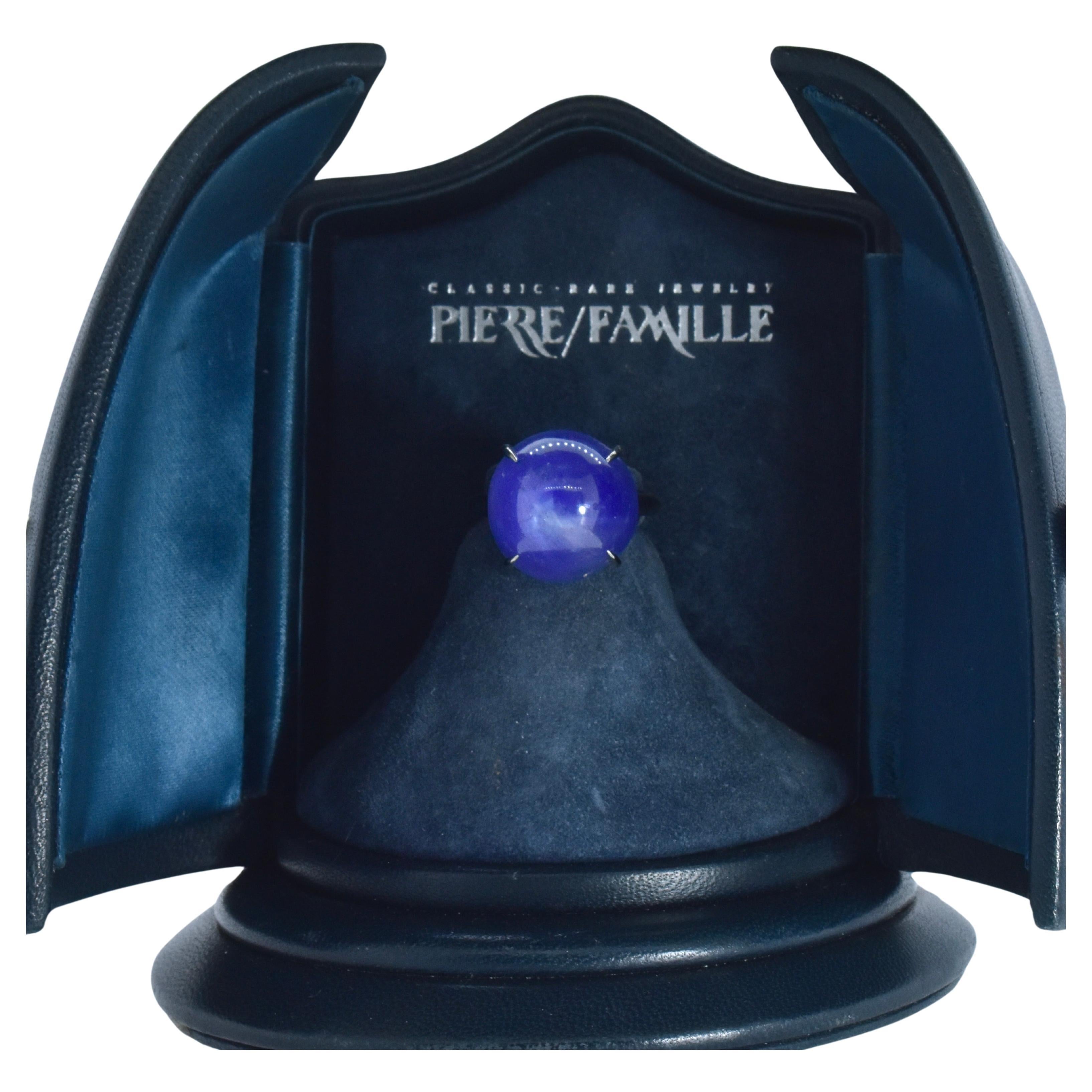 Star Sapphire, unheated, and Platinum Ring hand crafted by Pierre/Famille.   This cabochon cut  star sapphire weighs 32 cts., and is a pleasing medium blue color with a hint of violet. The handmade platinum mounting has a high polish, is simple and