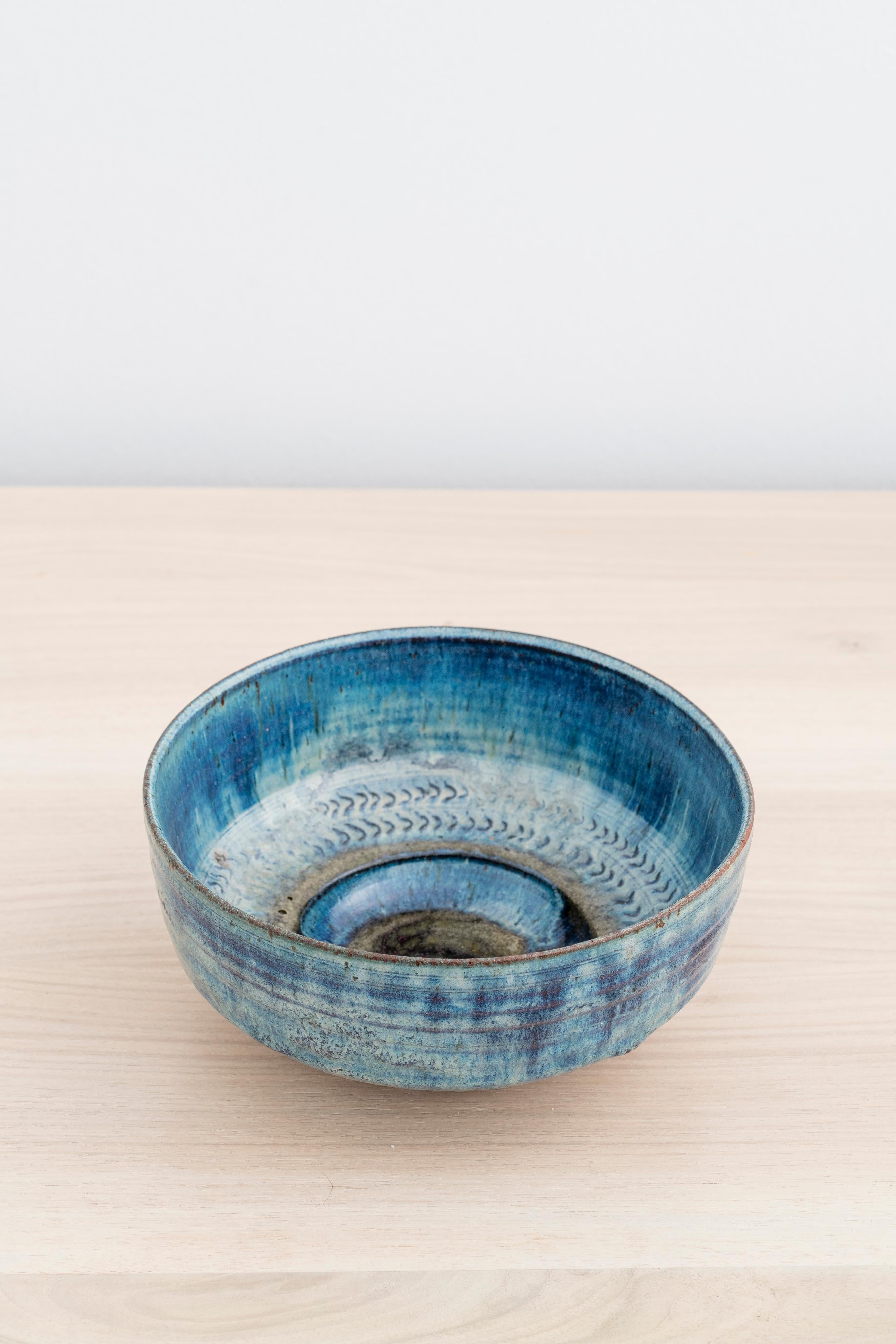 Unique stoneware bowl with blue glaze and impressed pattern by Gutte Eriksen

Incised with 