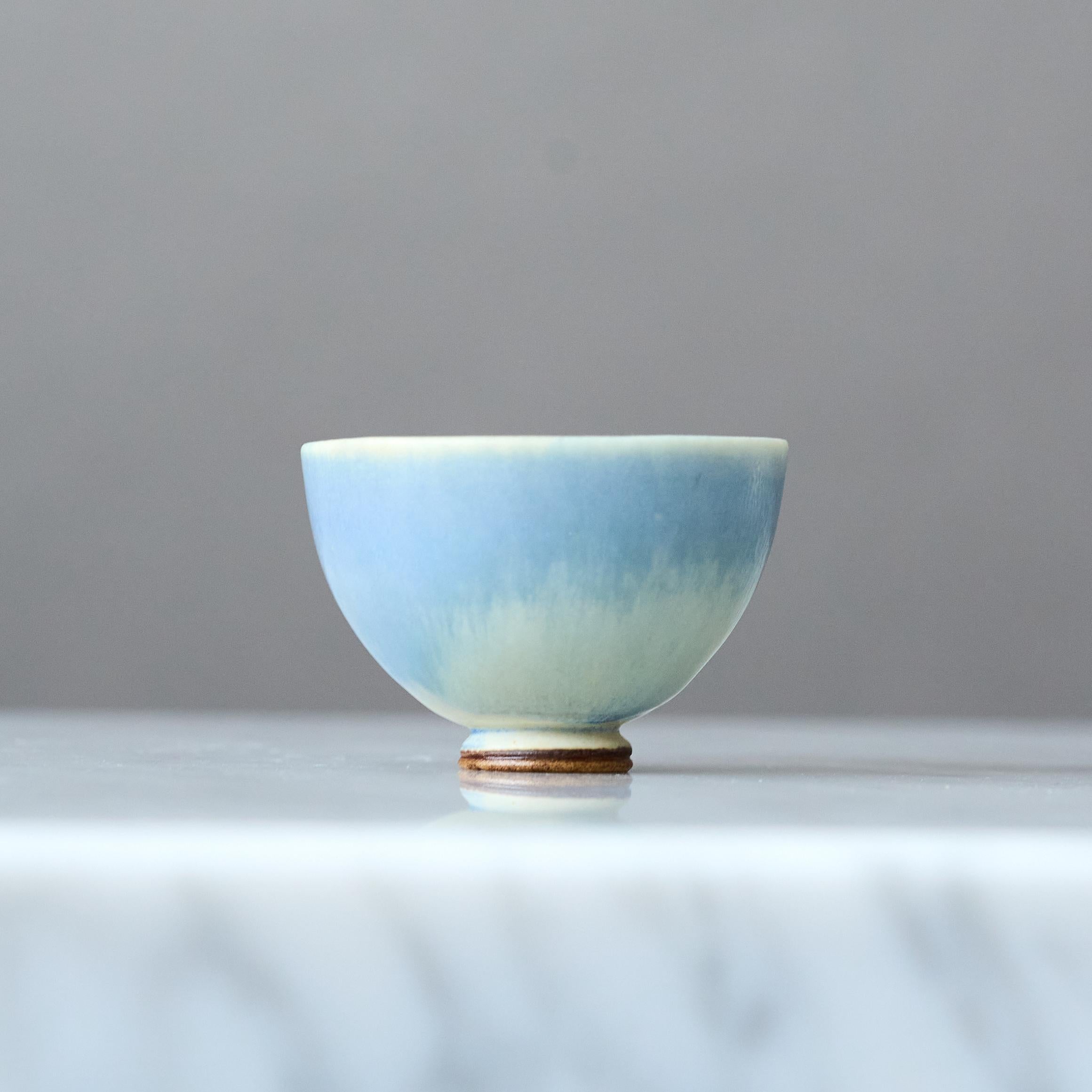 A beautiful miniature stoneware bowl with amazing light blue hare’s fur glaze.
Made by master thrower Berndt Friberg, in the artist's studio at Gustavsberg, Sweden, 1960s.

Great condition. 
Incised signature 'Friberg' and Gustavsberg studio