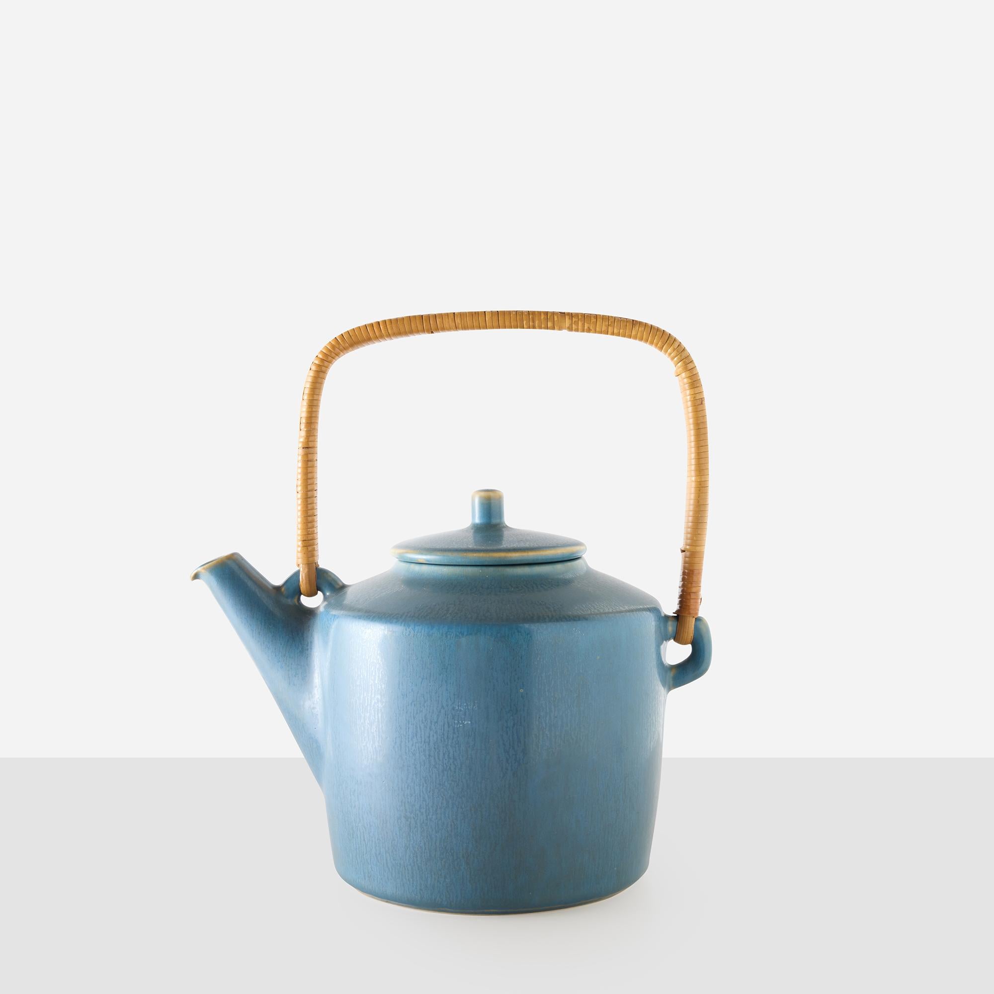 Blue Stoneware Teapot by Palshus
Denmark, c. 1960s

Stoneware teapot by Palshus, Denmark, finished in a blue hare’s fur glaze with a rattan-wrapped handle. Marked Palshus Stentöj, T4, Denmark, a model from the tableware series produced in the 1950s