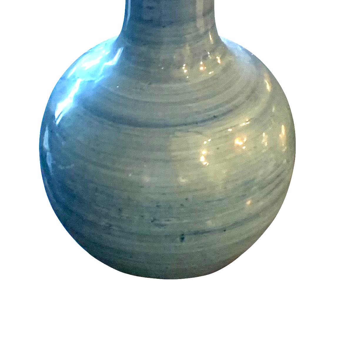 Contemporary Chinese pair blue striated design lamps. 
Tall tubular neck with rounded base.
Belgian linen shades.
Base measures 9