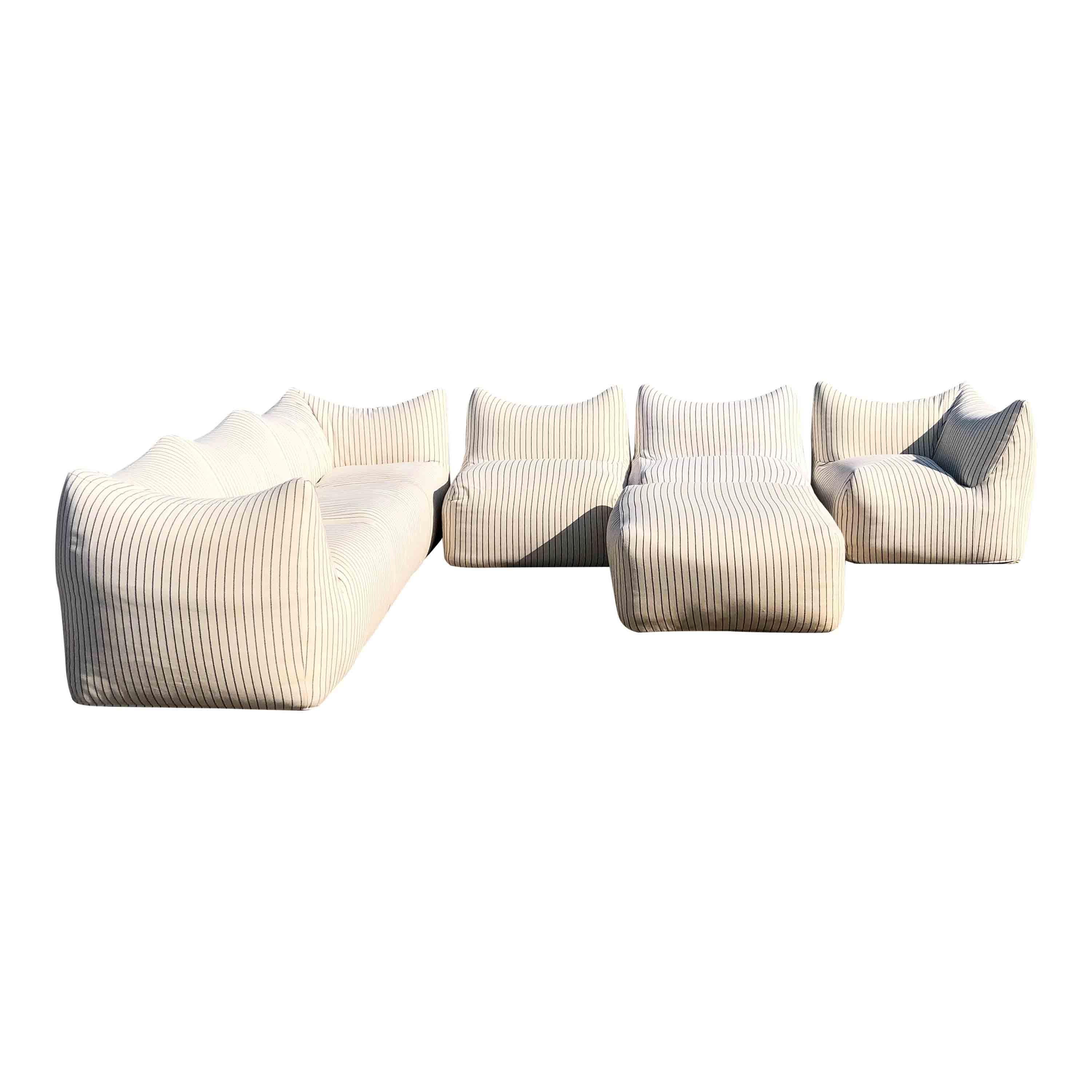 Majestic set of “Le Bambole” by Mario Bellini for B&B Italia.
The set is composed of:
 1 “Tribambola” three-seater sofa
 2 “Bambolina” modules
 1 “Bambangolo” angular module
 1 “Bambolona” big module
 2 “Bambouf” pouf modules
A vintage version from