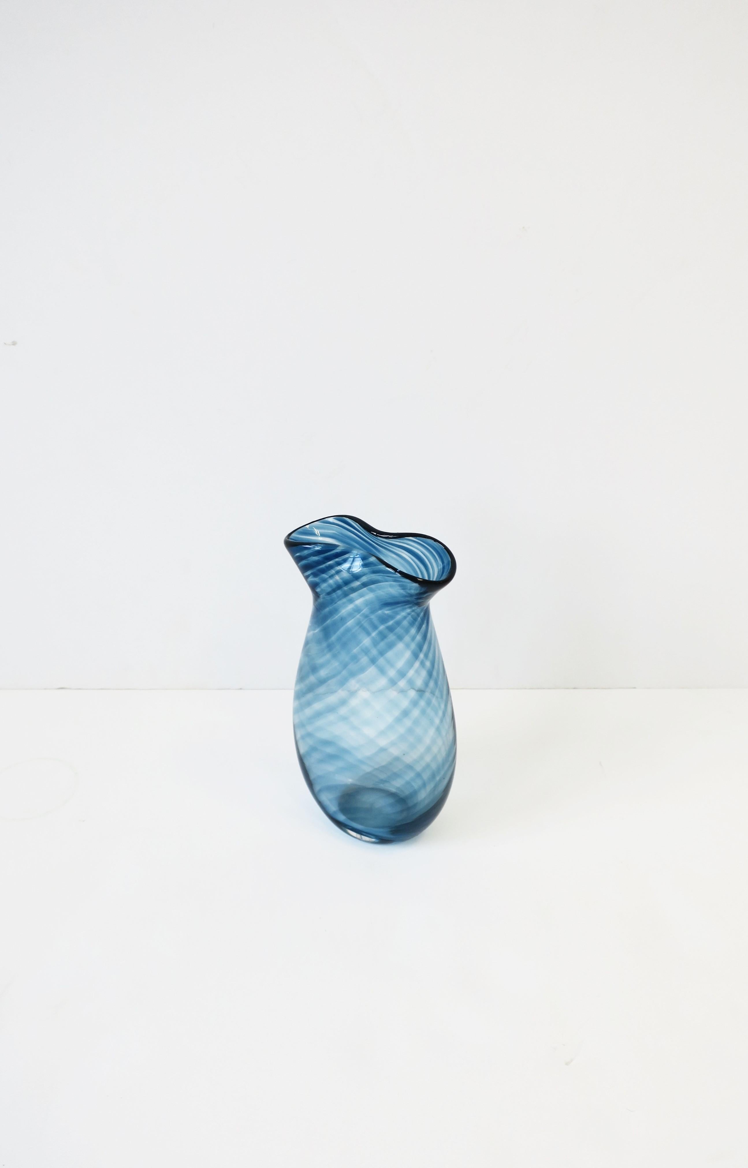 A beautiful and well-made blue and transparent studio art glass vase, circa early 21st century. Signed and dated on bottom by artist as shown in image #12. Nice weight for its size. Dimensions: 6.5
