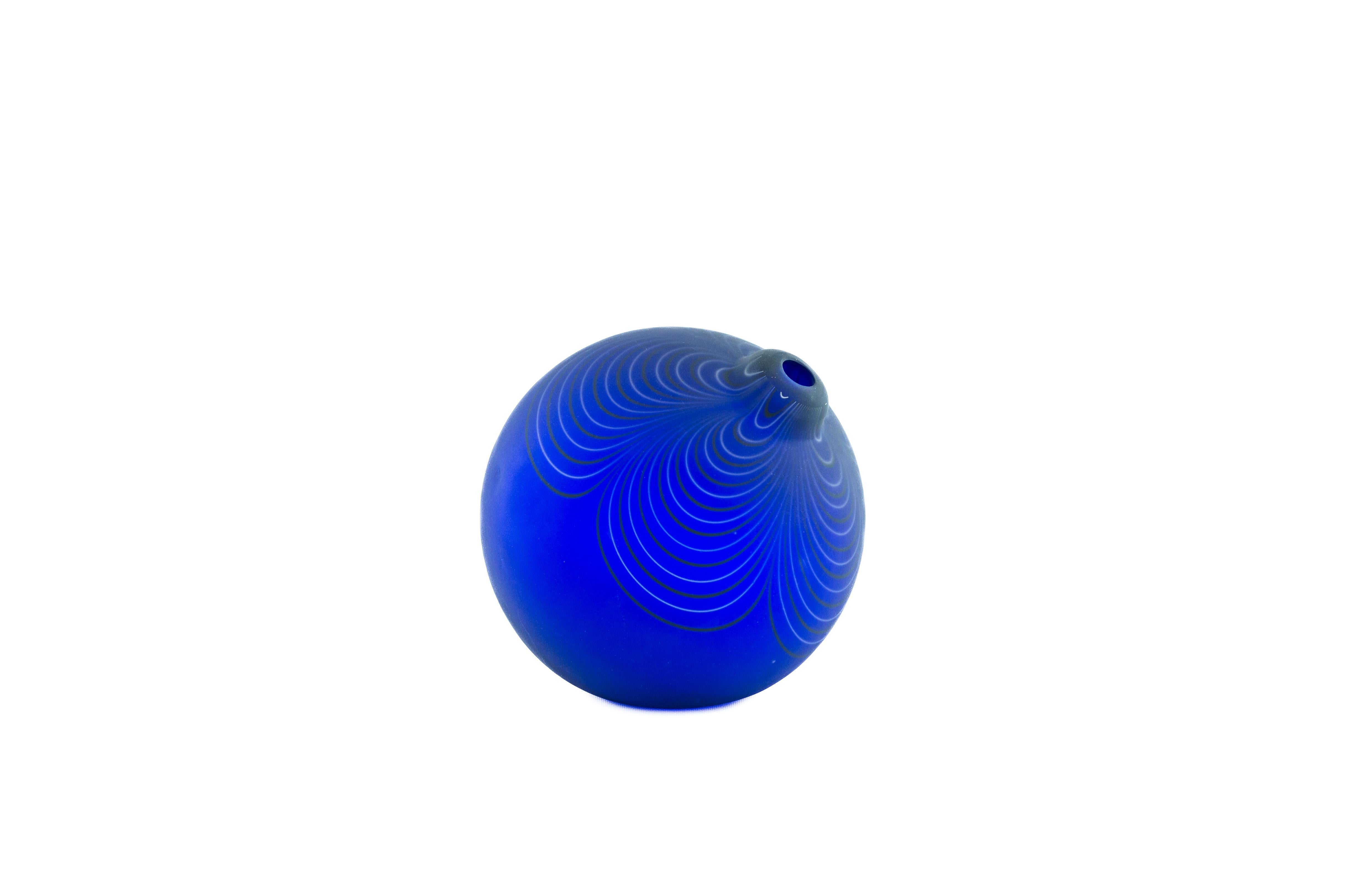 Discover this captivating Murano art glass sphere vase, a truly exquisite piece from the renowned Italian master glassblower Alberto Donà, meticulously crafted in 1980. This stunning Blue Swirl Murano Art Glass Sphere Vase embodies the innovative