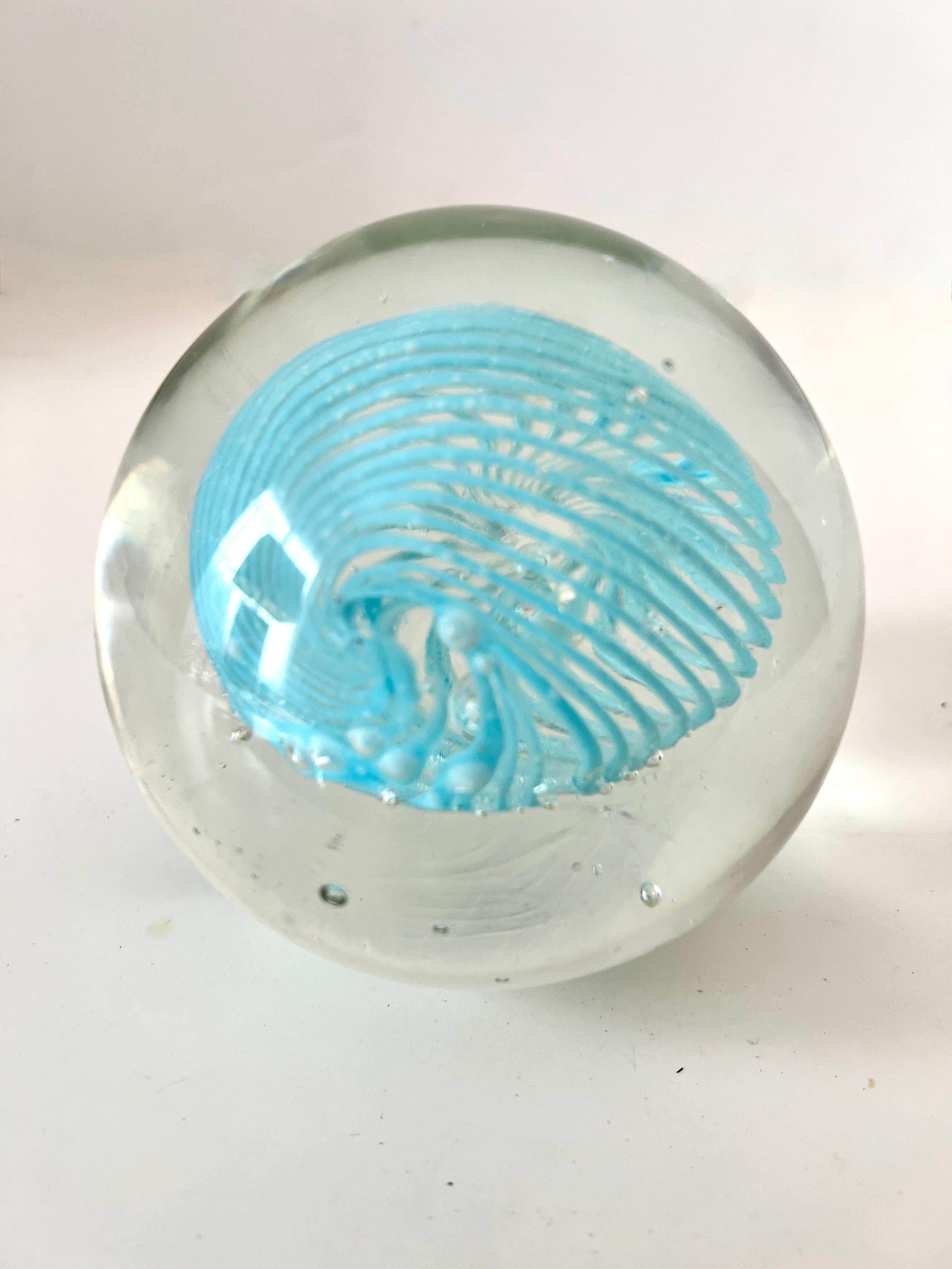 what does the glass paperweight symbolize