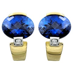 Blue Synthetic Sapphire and Natural Diamond Stud Earrings Set in 14 Karat Gold