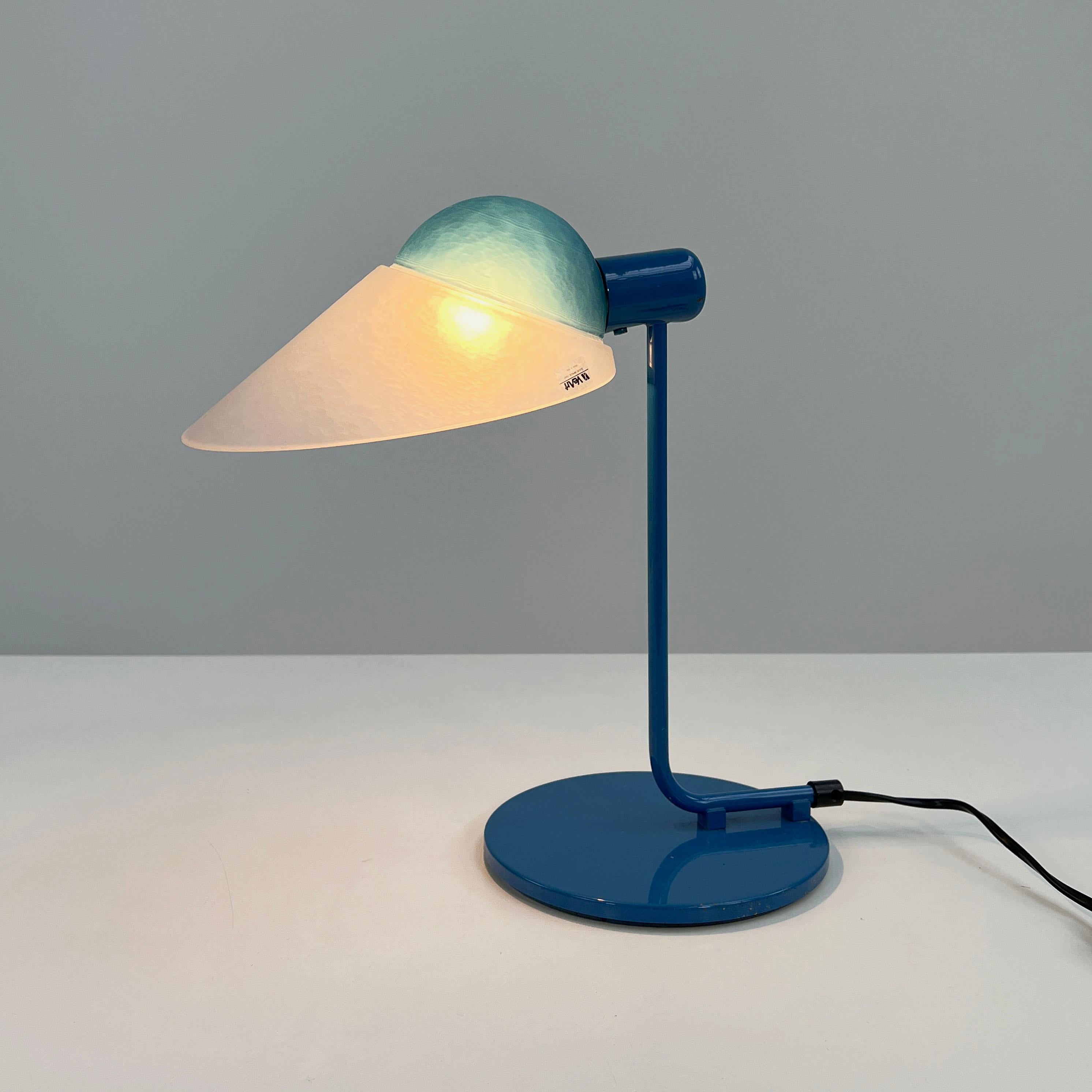 Blue table lamp in glass & metal from VeArt, 1980s
Producer - VeArt
Design Period - Eighties
Measurements - Width 18 cm x Depth 18 cm x Height 34 cm
Materials - Metal, glass
Color - Blue, white
Light wear consistent with age and use.