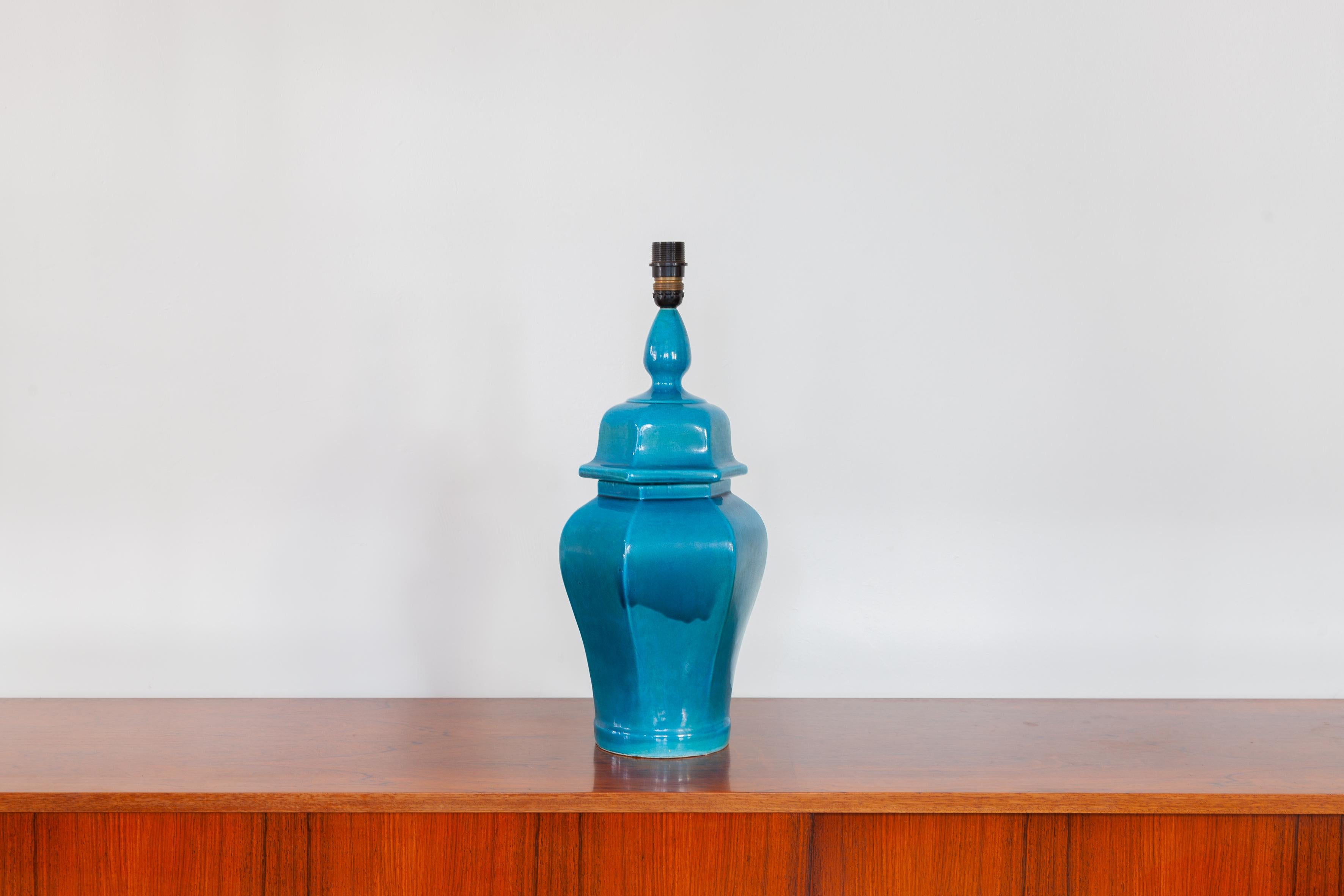 Ceramic blue glazed table lamp made in Italy with original shade. In original good condition.