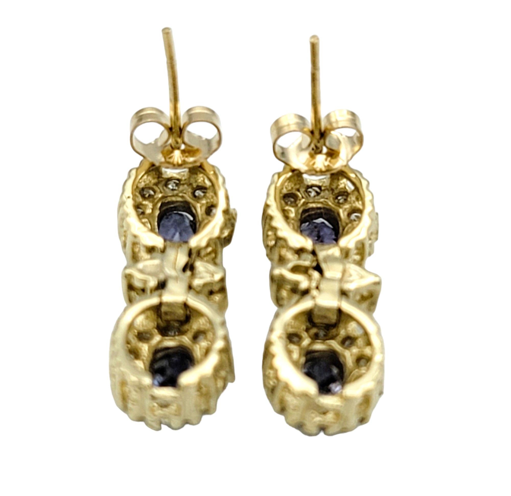 Blue Tanzanite and Diamond Halo Dangle Earrings Set in 14 Karat Yellow Gold In Good Condition For Sale In Scottsdale, AZ