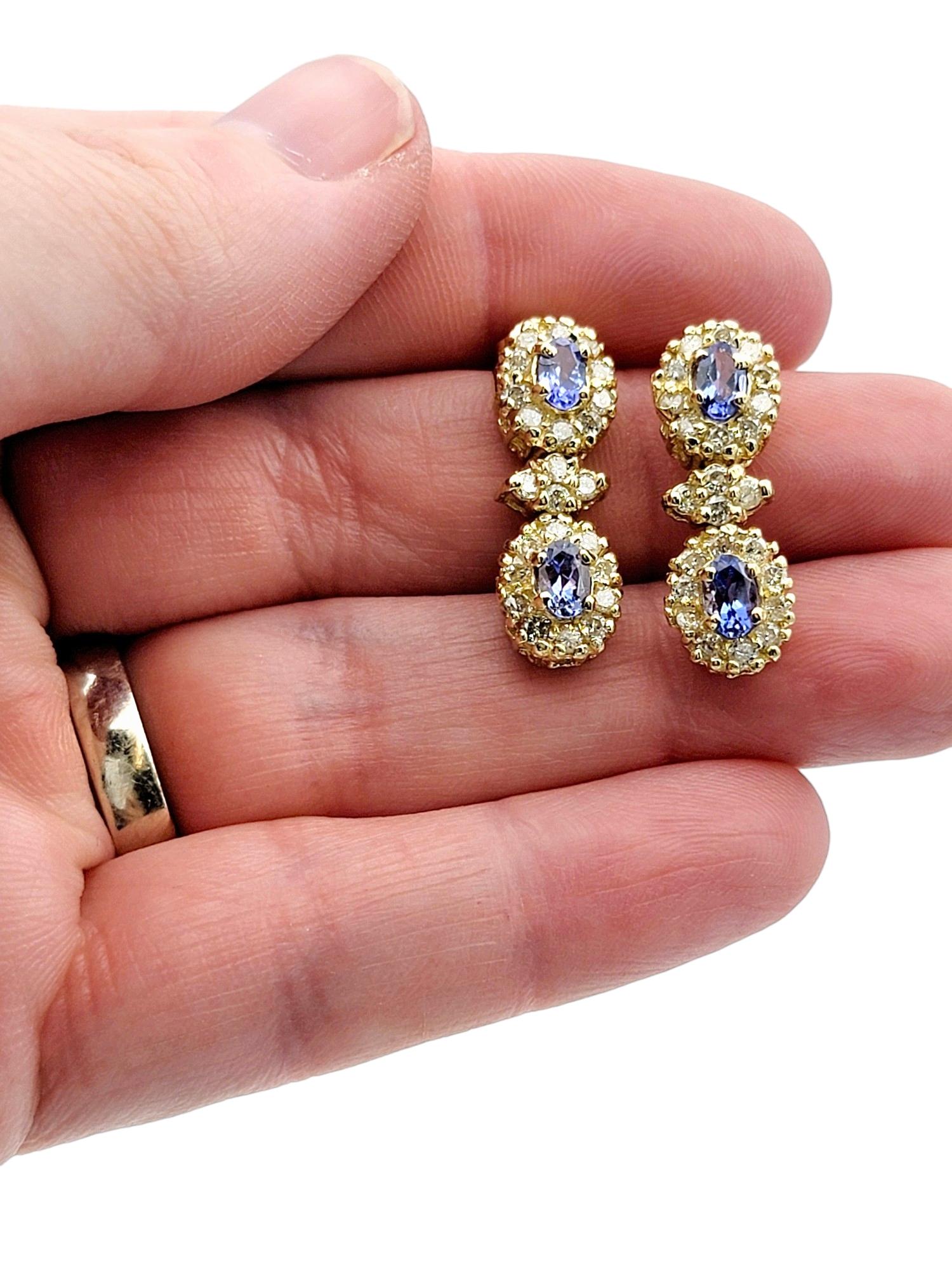 Blue Tanzanite and Diamond Halo Dangle Earrings Set in 14 Karat Yellow Gold For Sale 1