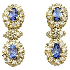 Blue Tanzanite and Diamond Halo Dangle Earrings Set in 14 Karat Yellow Gold
