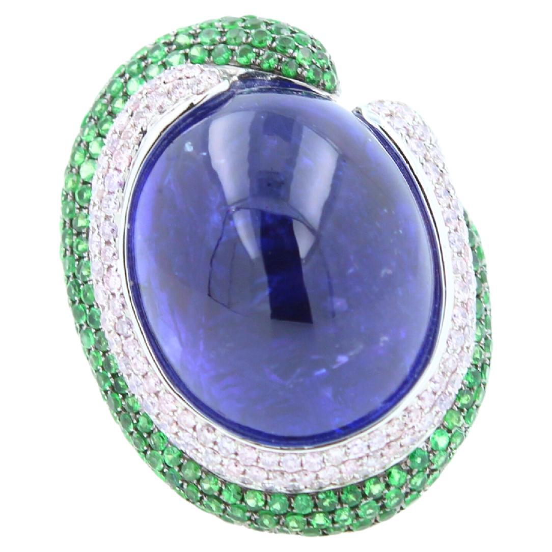 Art Deco Blue Tanzanite Oval Cabochon Diamonds Tsavorites Pave 18k White Gold Unique Ring For Sale