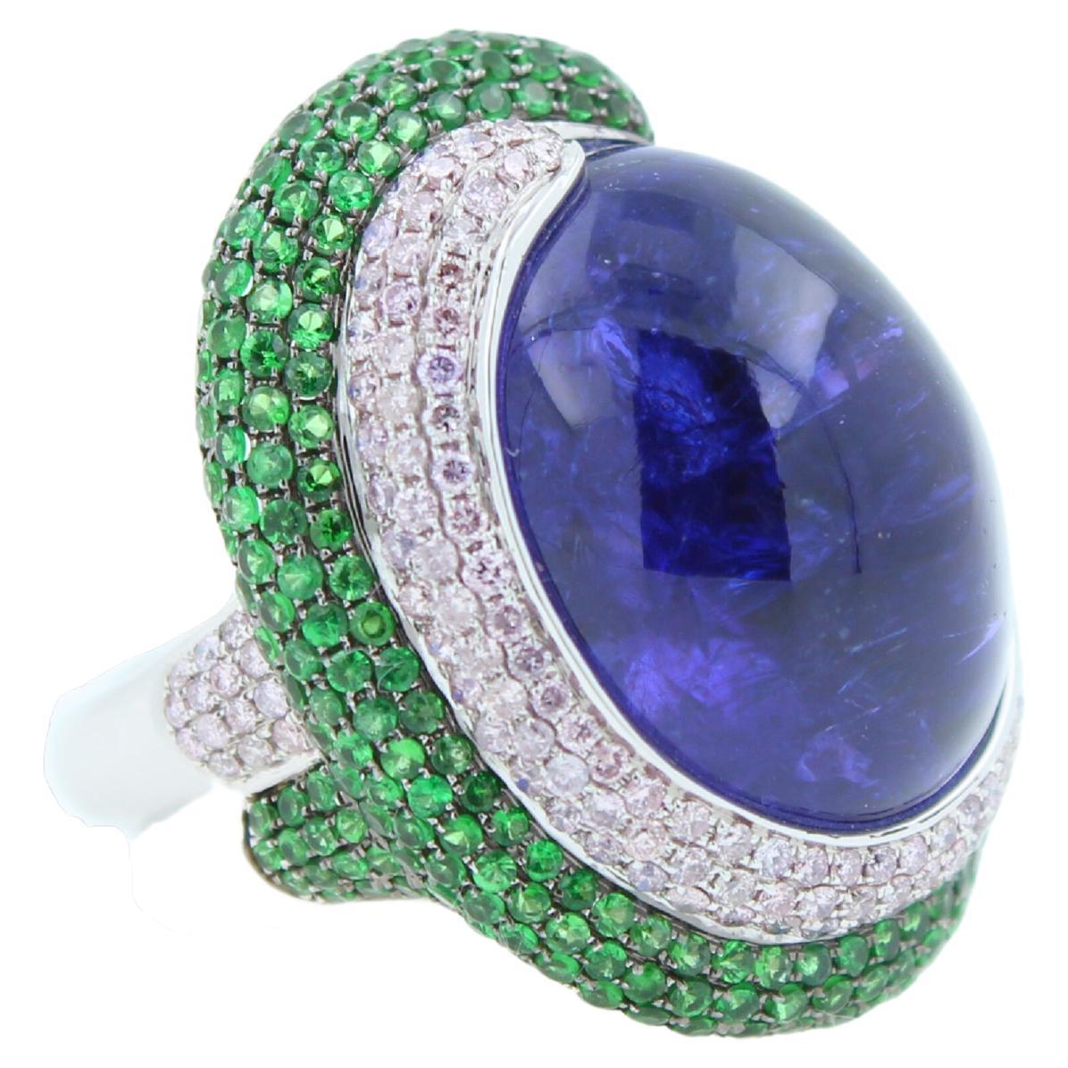 Oval Cut Blue Tanzanite Oval Cabochon Diamonds Tsavorites Pave 18k White Gold Unique Ring For Sale