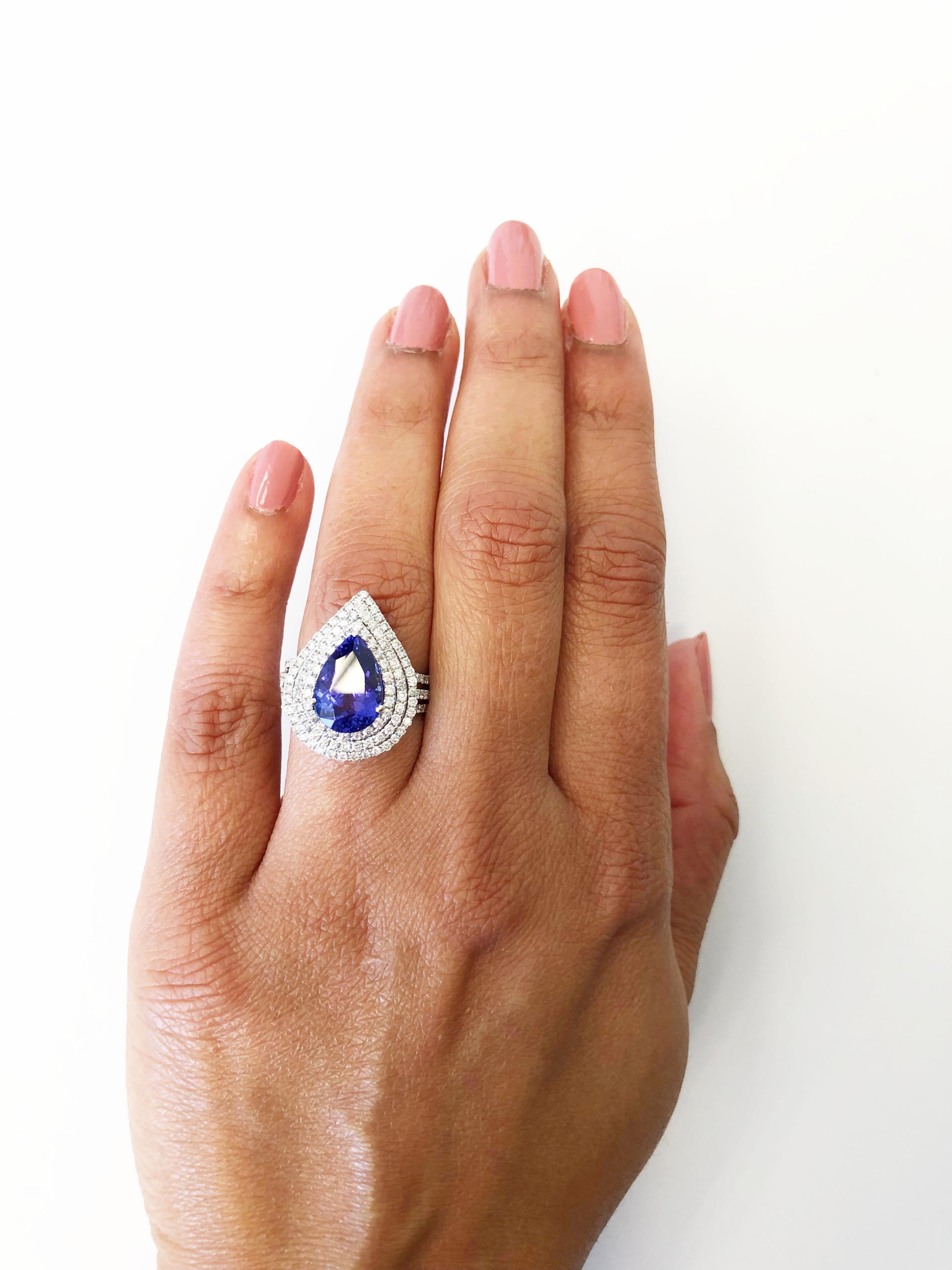 Beautiful deep blue tanzanite pear shape weighing 4.20 carats with 1.10 carats of good quality white diamond rounds. Handmade mounting in 18k white gold size 6.5.  Perfect as a cocktail ring or to wear on a daily basis.


 