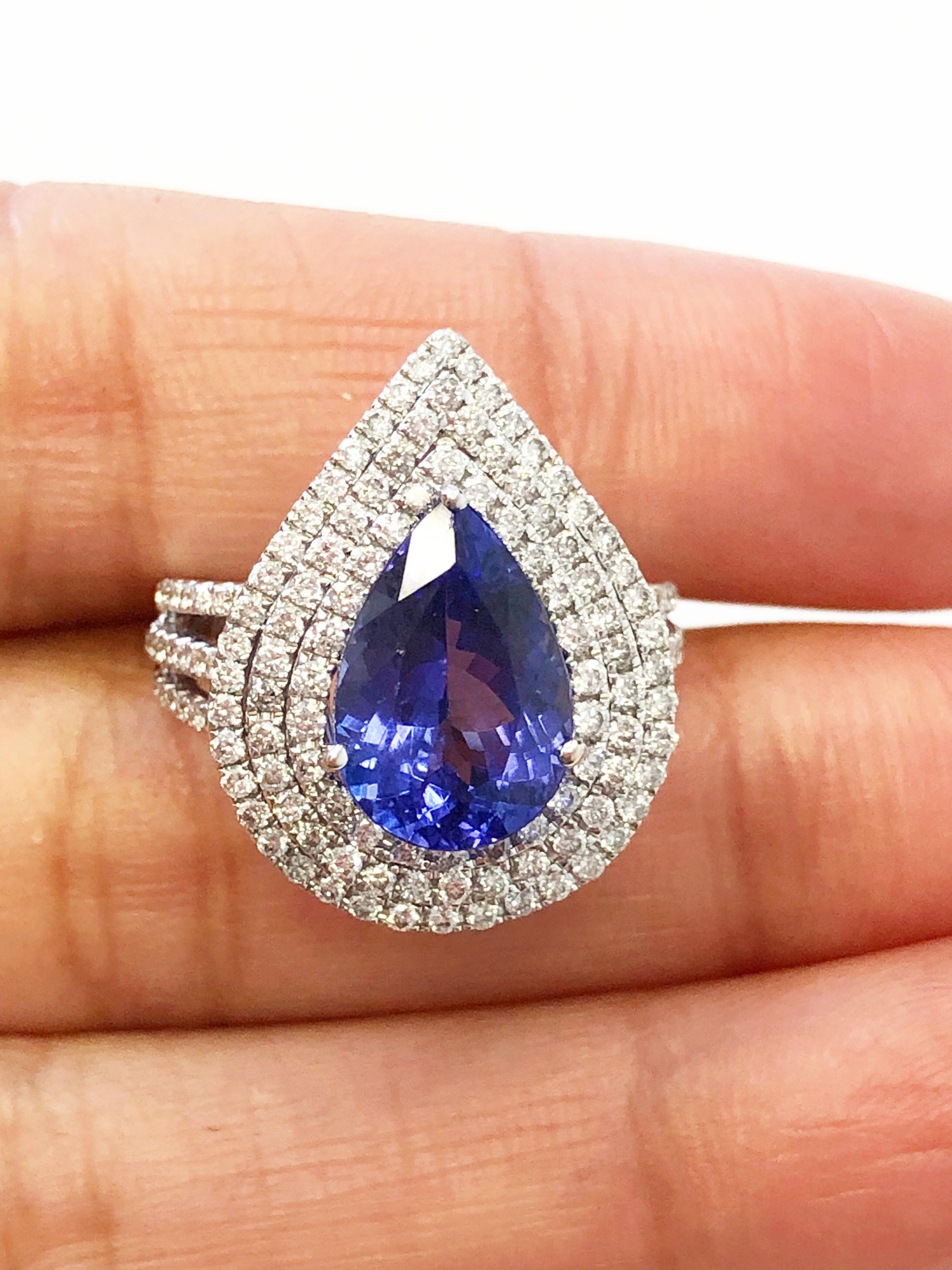 Blue Tanzanite Pear Shape and White Diamond Round Cocktail Ring in 18 Karat In New Condition In Los Angeles, CA