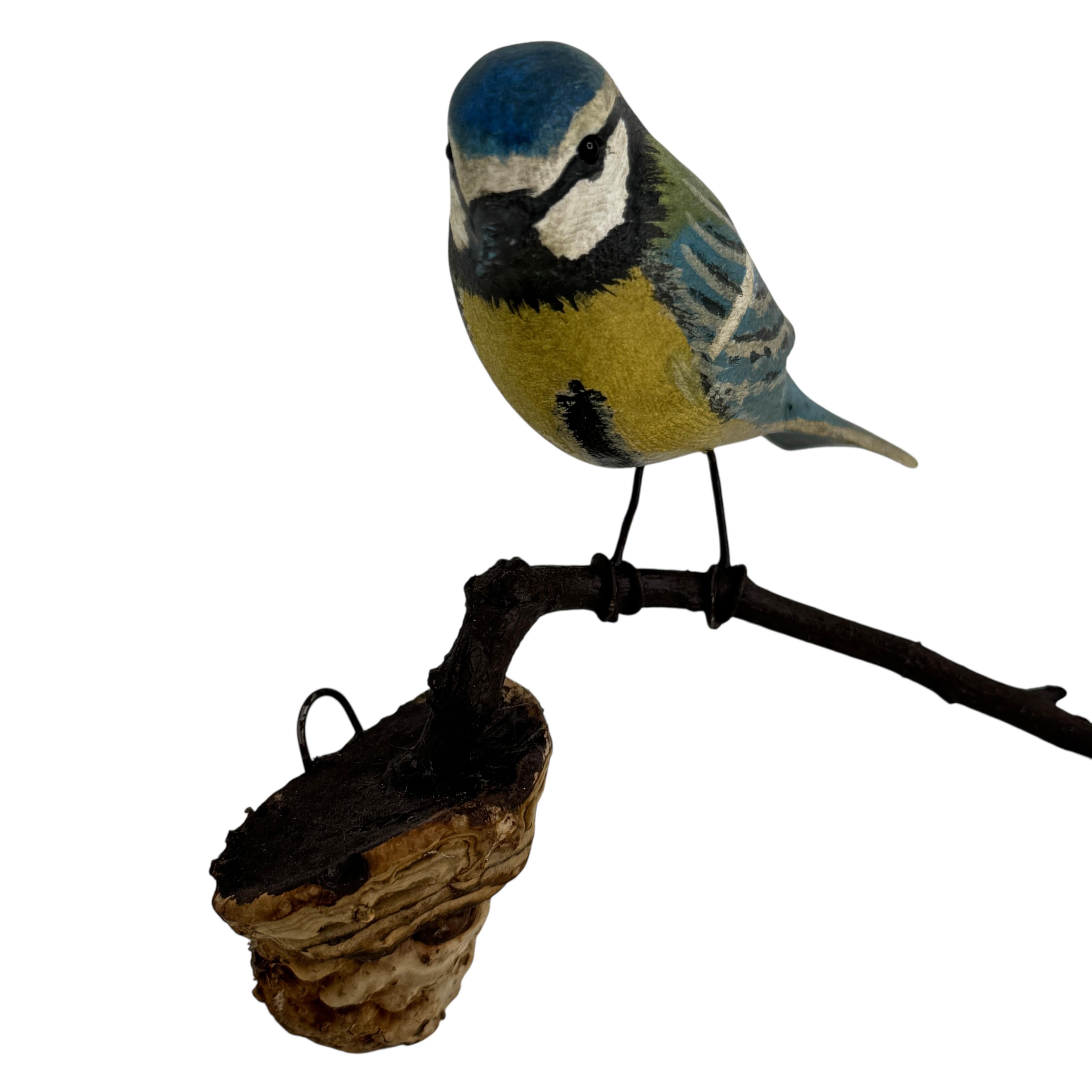 A beautiful Austrian 20th century, carved wood bird, mounted on a stand for hanging. The tradition of these in Austria called 
