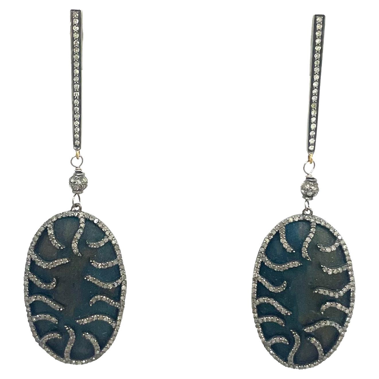 Boucles d'oreilles Paradizia en titane bleu et diamants pavés