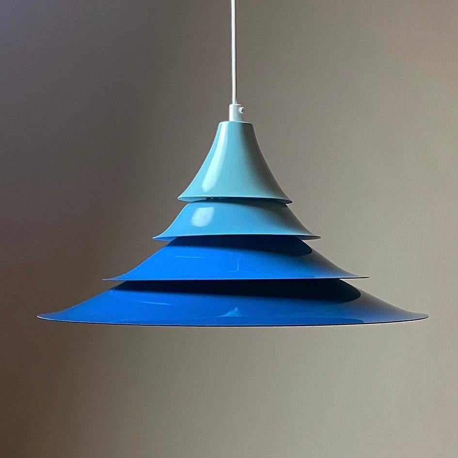 Amazing colorful ceiling light from Lyskaer, Denmark 1970s. 

Four shades with four different colors of blue glaced lacquer. 

Stunning condition with very few signs of wear.

Light source: E27 / E26 edison screw fitting max 100W. Comes with