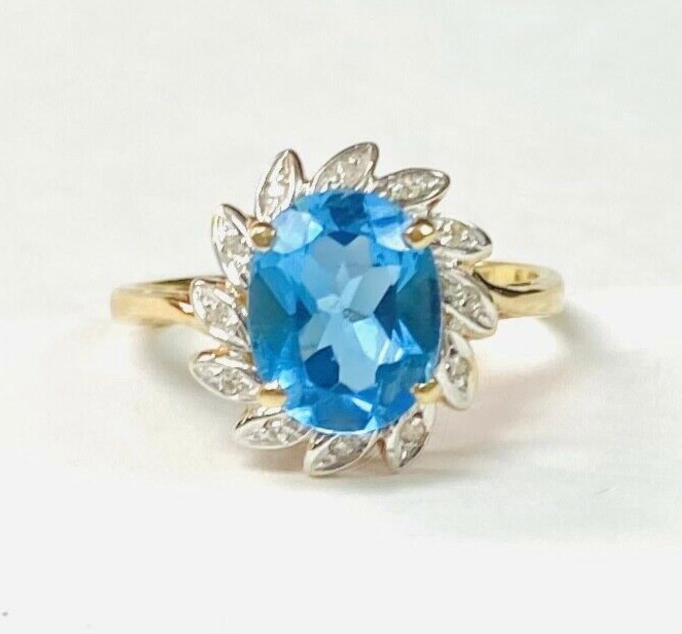 Oval Cut Blue Topaz 14K Yellow Gold and Diamond Ring For Sale