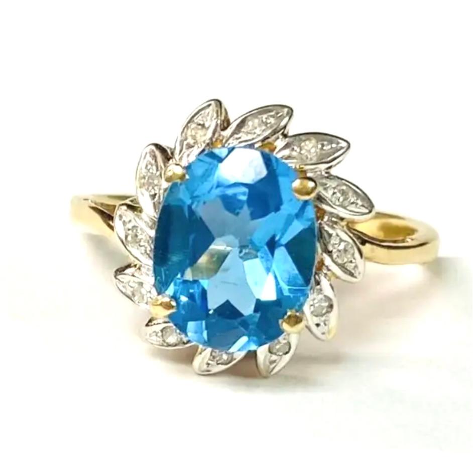 Bague en or jaune 14 carats avec topaze bleue et diamants en vente 1
