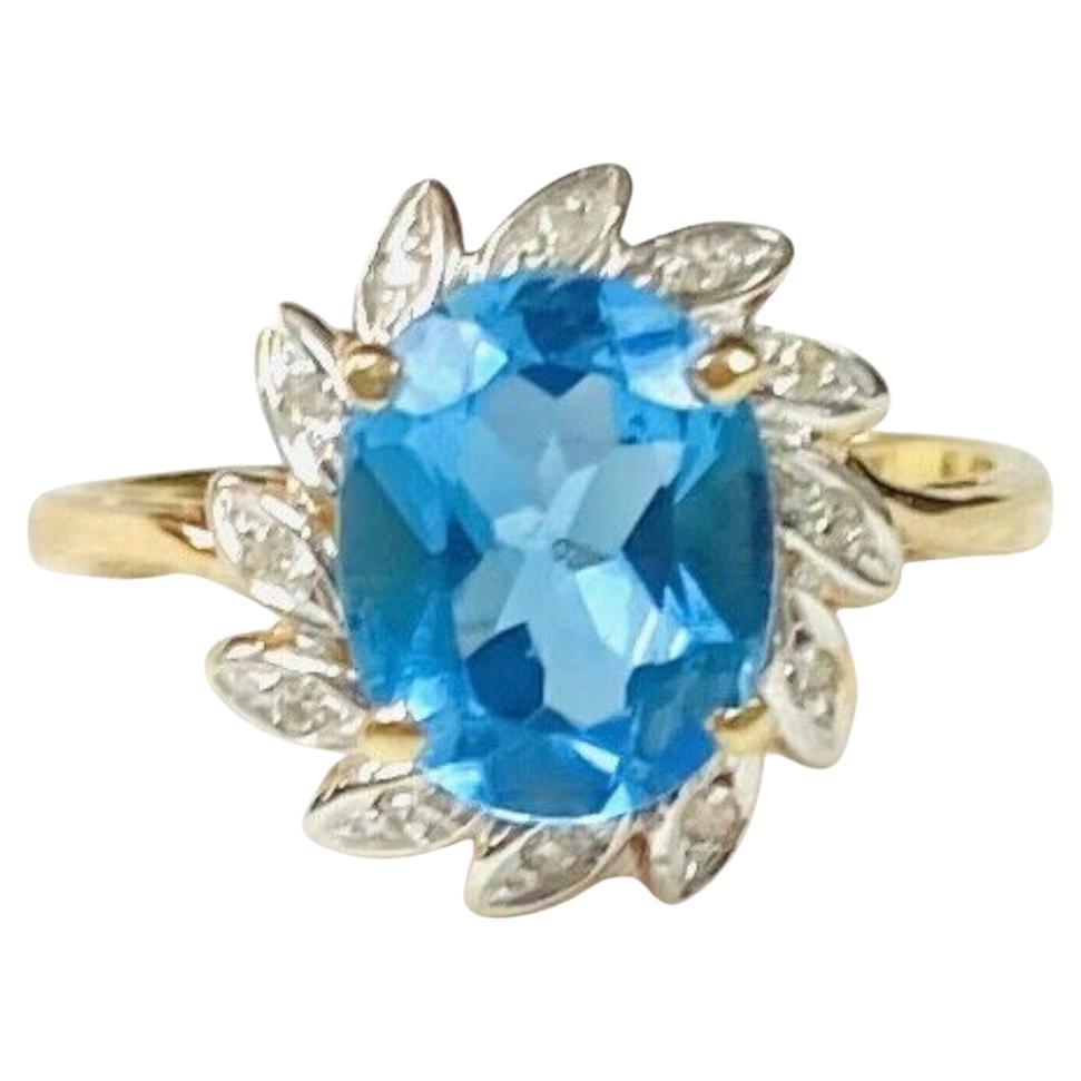 Bague en or jaune 14 carats avec topaze bleue et diamants