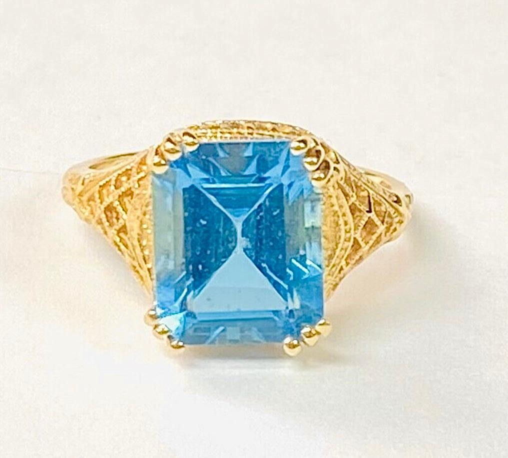 Emerald Cut Blue Topaz 14K Yellow Gold Ring For Sale