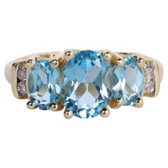 Anello blu TOPAZ con 3 pietre passato presente futuro 10k