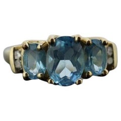Anillo TOPAZ azul 3 piedras pasado presente futuro. 10k THL Samuel Aaron