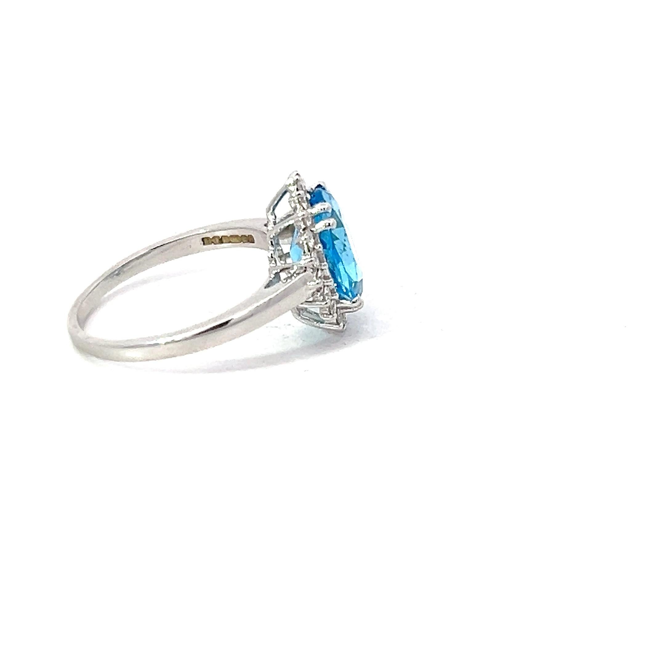 Blue Topaz 3.13 Carat Oval 0.24 Carat Round Diamond 18 KT White Gold Halo Ring For Sale 3