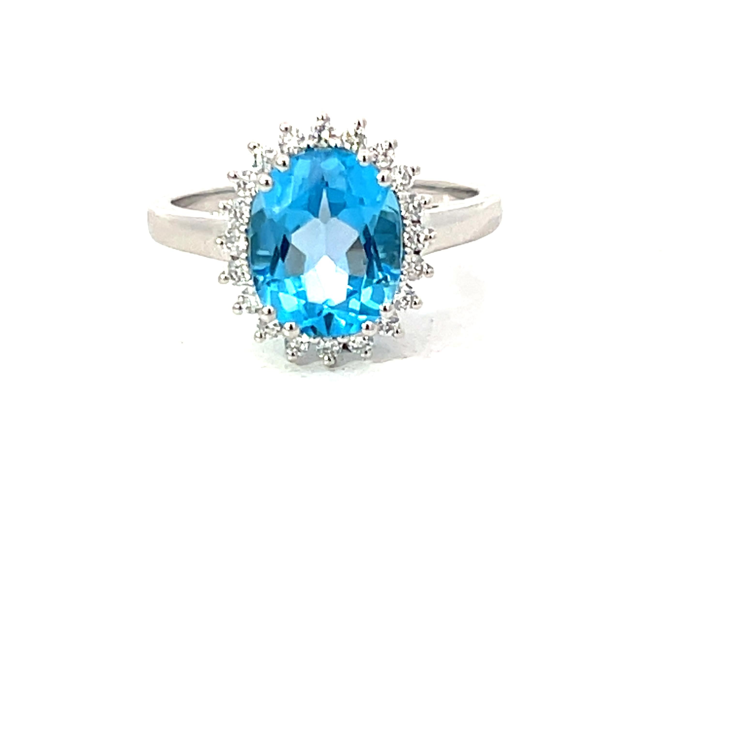Blue Topaz 3.13 Carat Oval 0.24 Carat Round Diamond 18 KT White Gold Halo Ring For Sale 5
