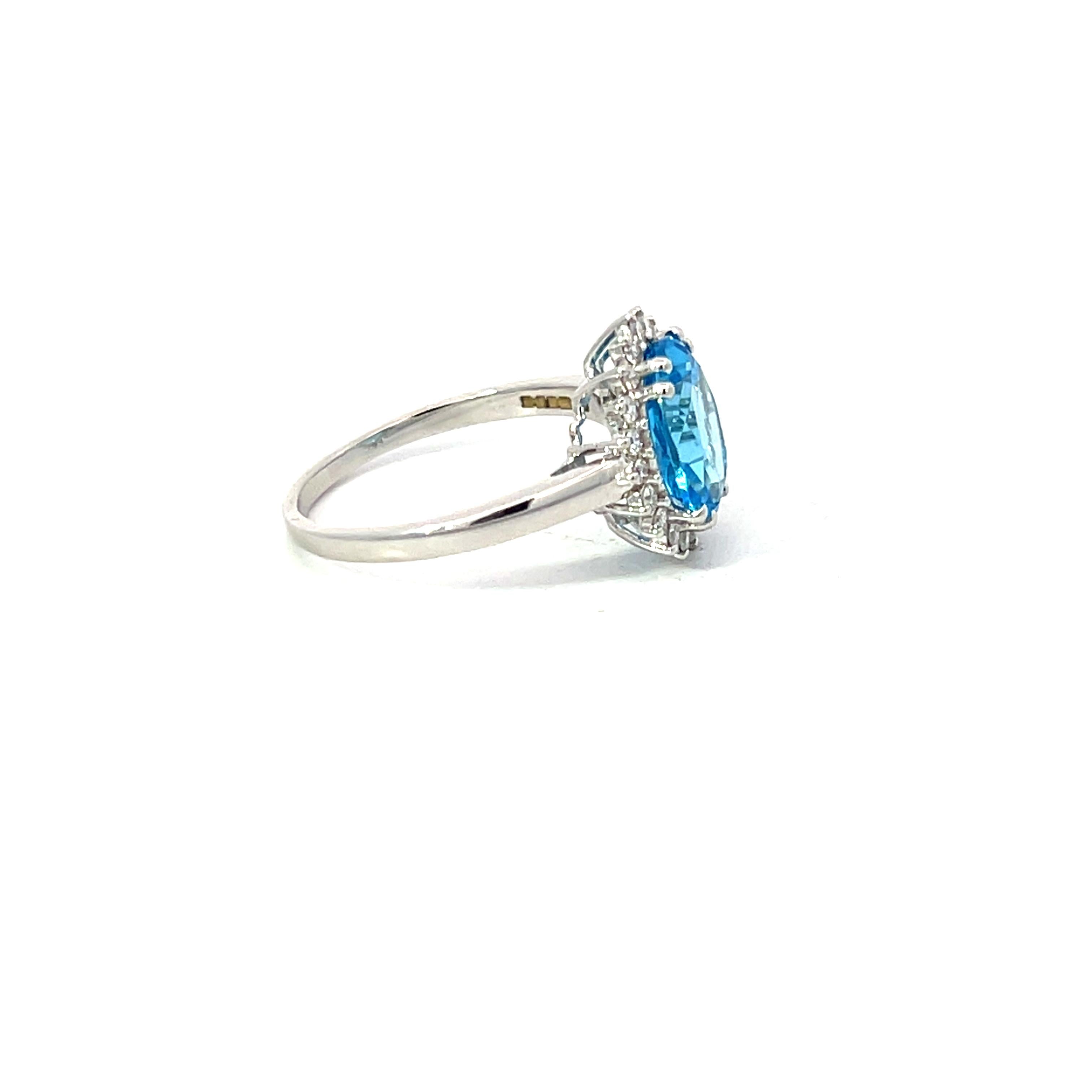 Blue Topaz 3.13 Carat Oval 0.24 Carat Round Diamond 18 KT White Gold Halo Ring For Sale 6