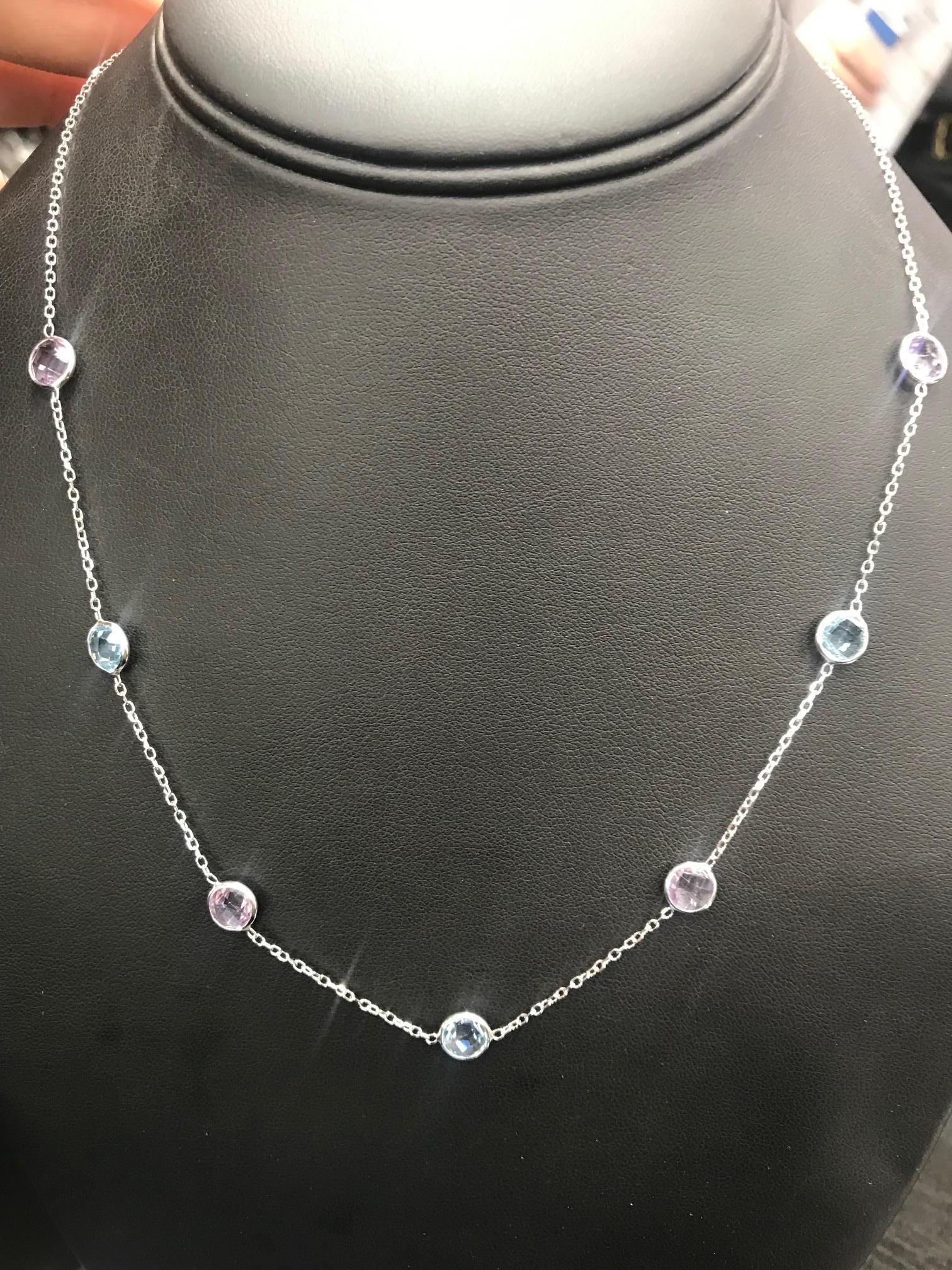 14K White gold neclace featuring 5 blue topaz and 5 purple amethyst in a bezel setting. 