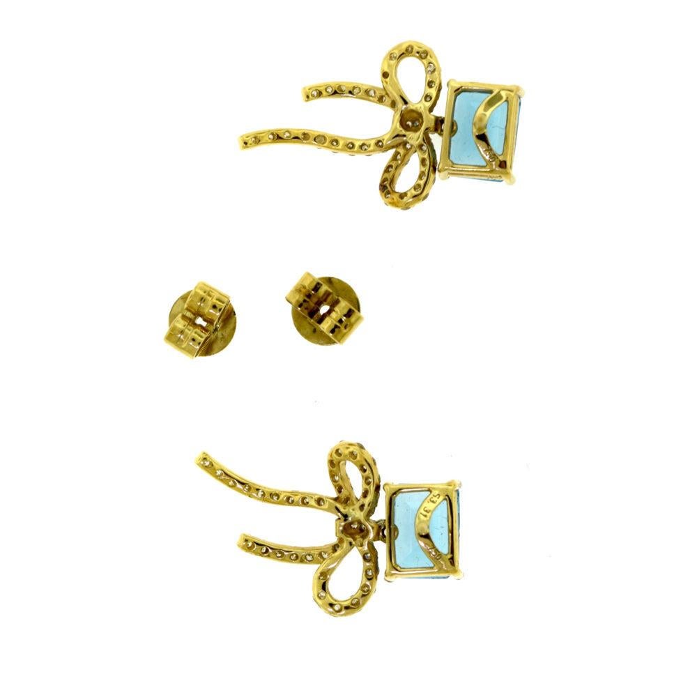 Emerald Cut Blue Topaz and Diamond Bow Tie Ribbon 18 Karat Yellow Gold Earrings For Sale