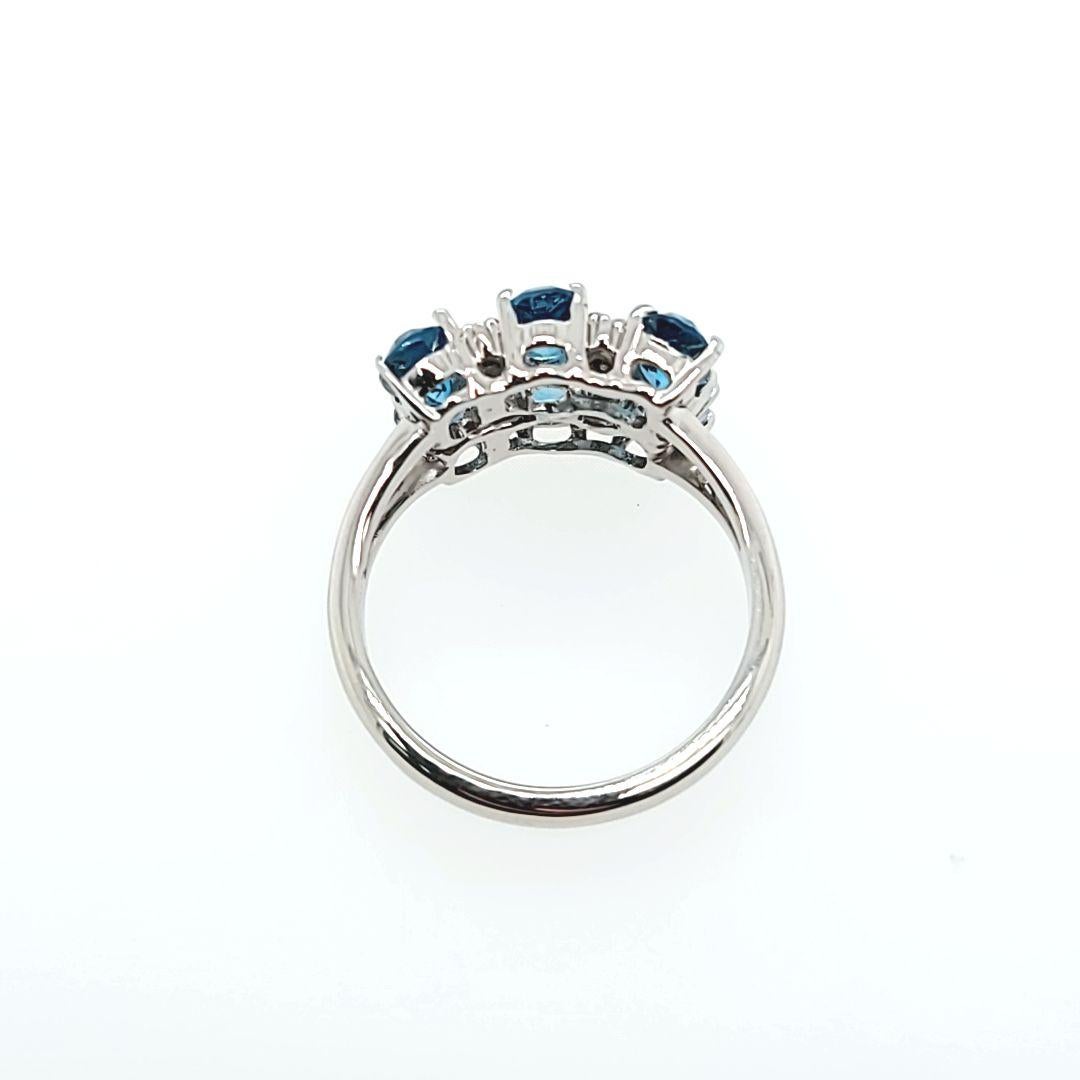 Oval Cut Blue Topaz and Diamond Cluster Ring For Sale