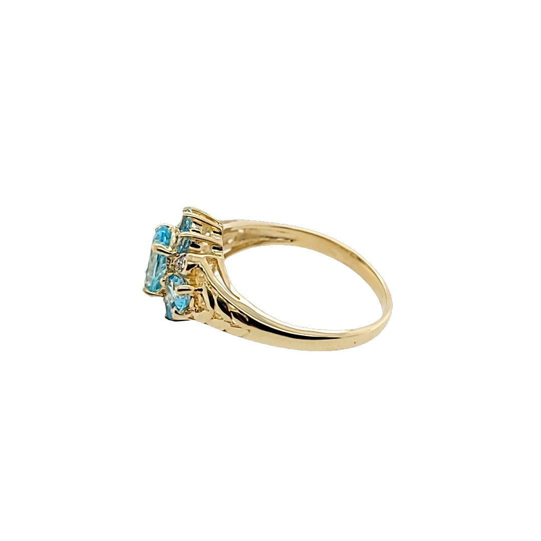 Oval Cut Blue Topaz and Diamond Cluster Ring in Yellow Gold For Sale