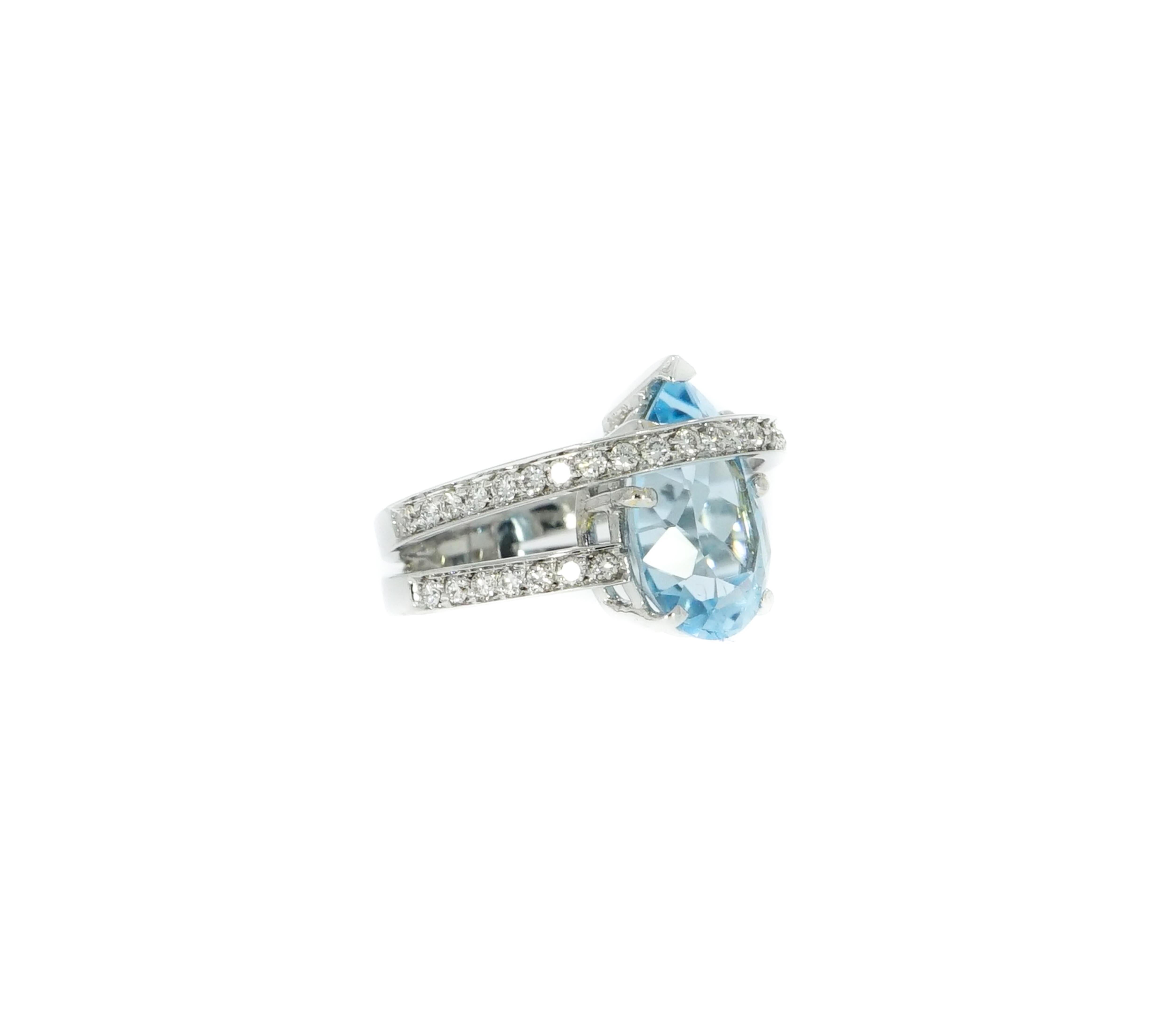 Get the sparkles you'd always been looking for...
This gorgeous Pear Shaped Blue Topaz and Diamonds Cocktail Ring is stunning!!!
Handcrafted in 18k white gold featuring a beautiful pear shaped Blue Topaz center and decorated with a band of 0.54