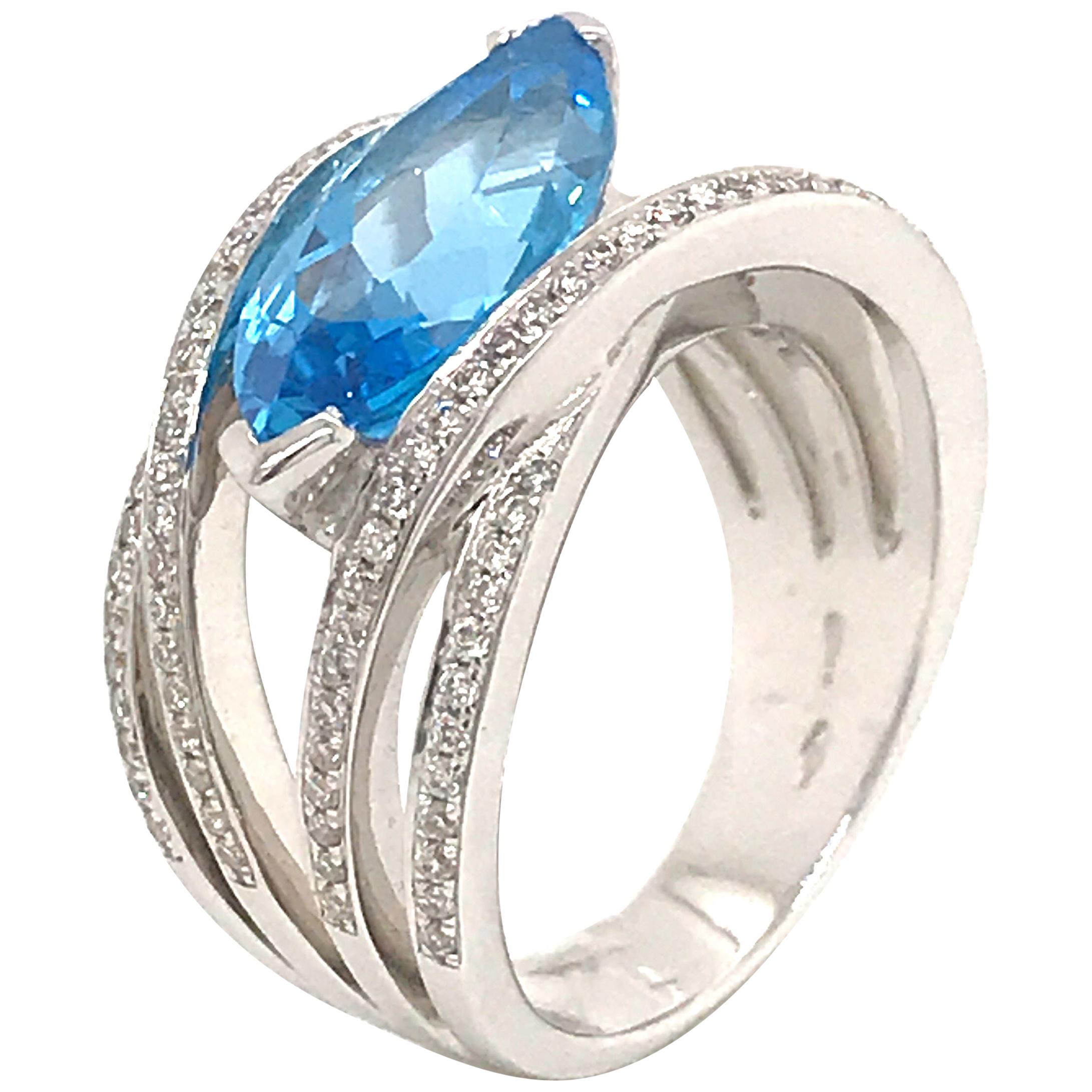 Blue Topaz and Diamond Color G -VS Marquise Shape Gold 18 Karat Fashion Ring