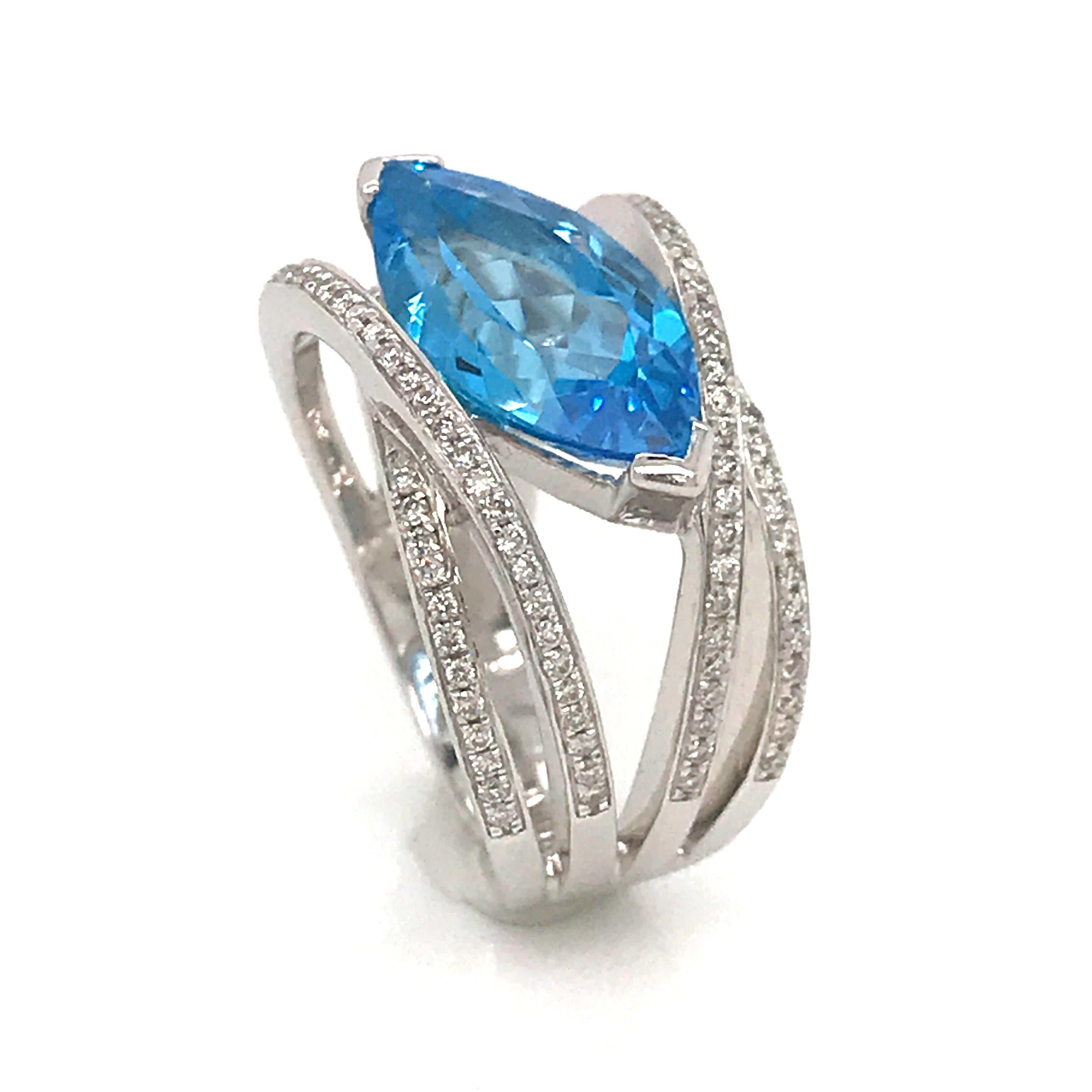 Discover this Creation Fashion ring Marquise Shape with Blue Topaz of 0.42 ct From Brazil 
Decorated with diamonds Color G-VS 0.83 ct 
White Gold 18 k / 8.4 grams 
French Size 54
US Size 7