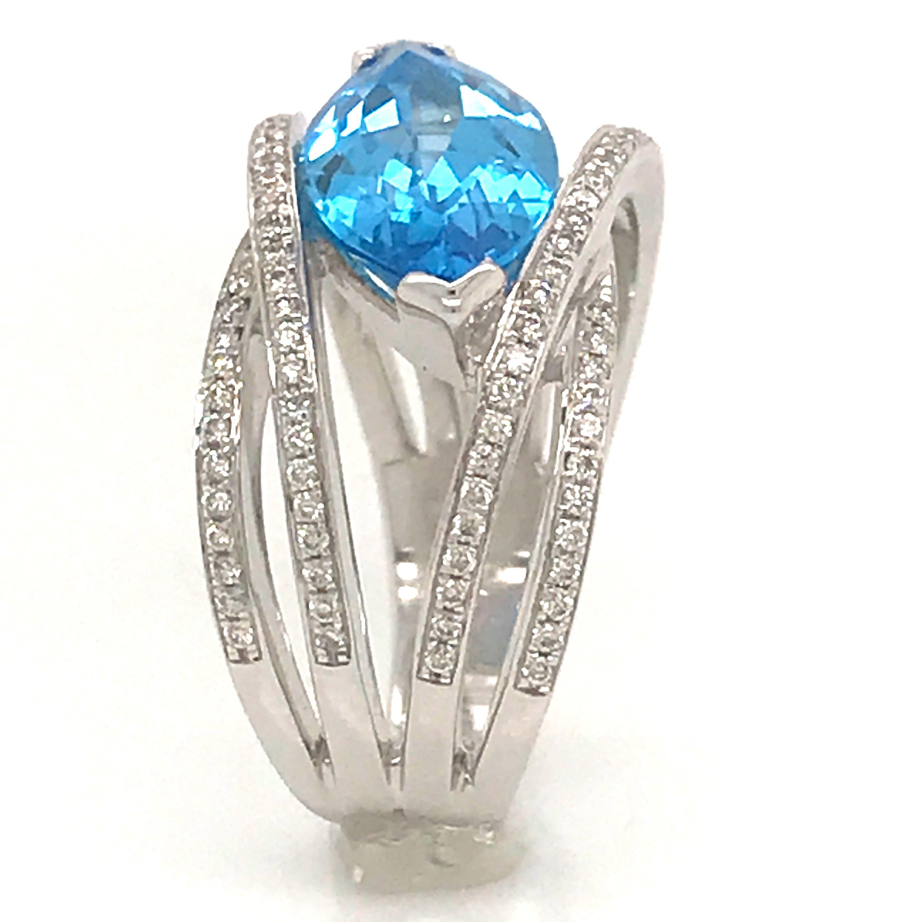 Contemporary Blue Topaz and Diamond Color G -VS Marquise Shape Gold 18 Karat Fashion Ring