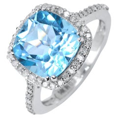 black and blue or white and gold Blue Topaz and Diamond Cushion Ring in 14k White Gold