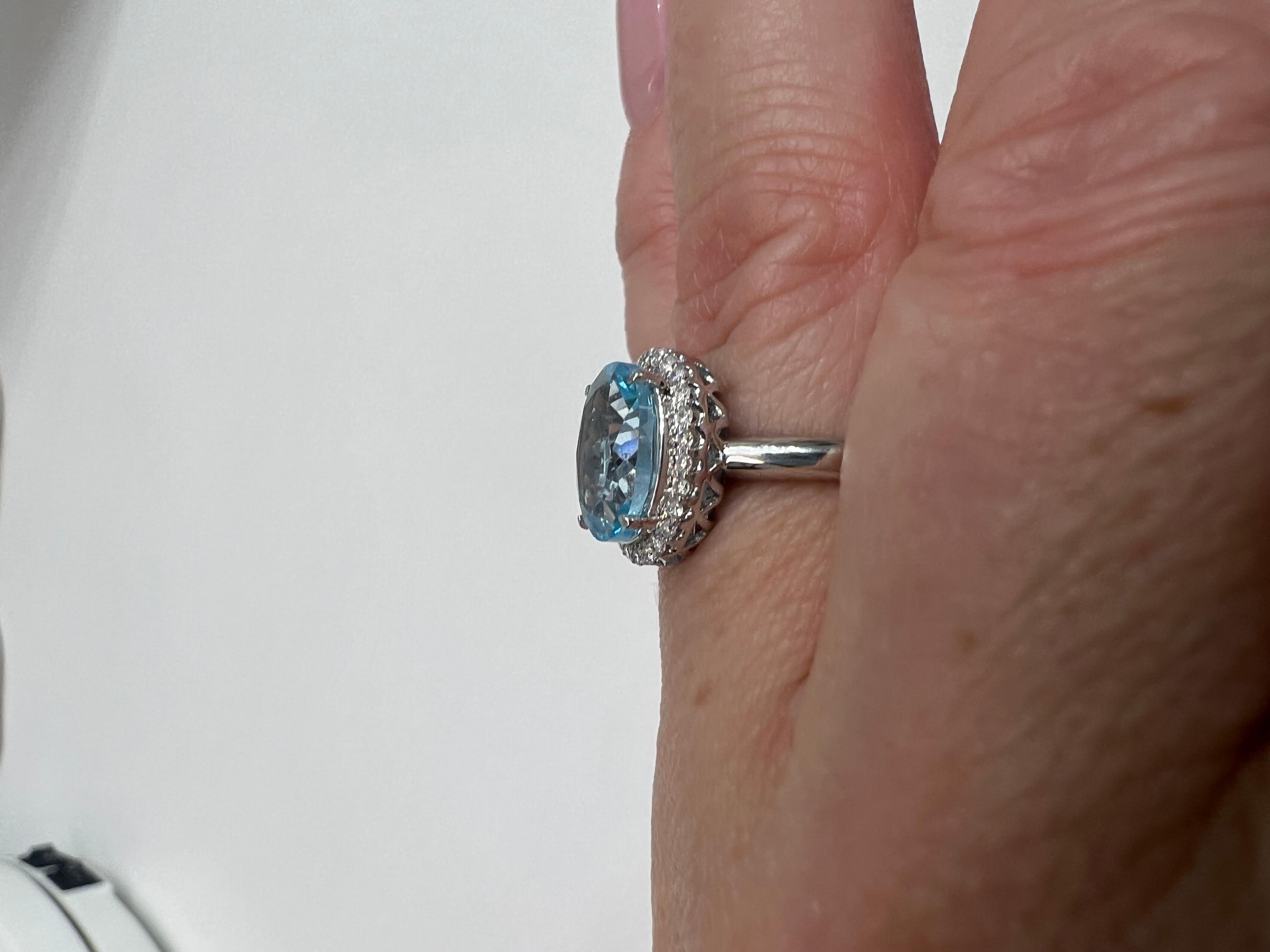 Contemporary Blue Topaz and Diamond Halo Ring, 10k White Gold