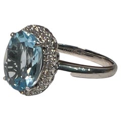 Used Blue Topaz and Diamond Halo Ring, 10k White Gold