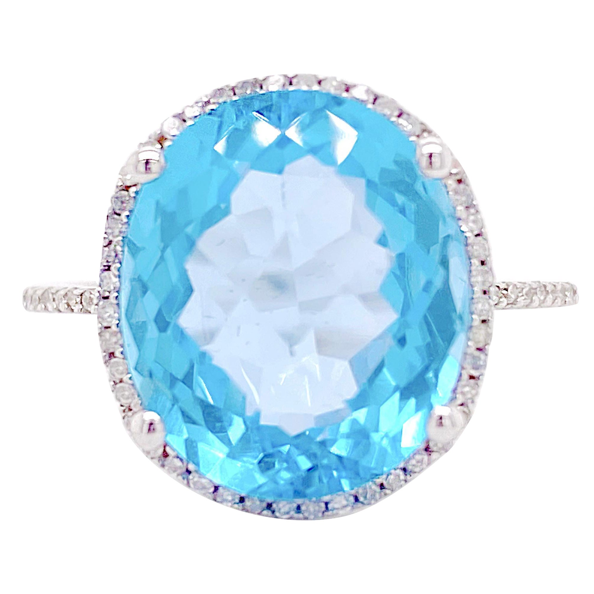 Anello aureola con topazio blu e diamanti, topazio blu ovale, oro bianco e punte di diamante