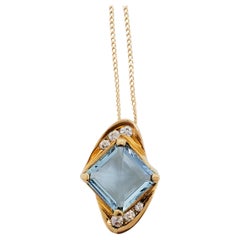 Blue Topaz and Diamond Pendant Necklace in 14k Yellow Gold