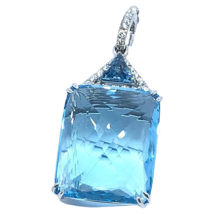 Blue Topaz 32.29 carats, Blue Topaz 0.67 carat and Diamond 0.22 carat Pendant set in 18 Karat White Gold Settings
(chain not included)

Width: 1.8 cm 
Length: 4.2 cm
Total Weight: 11.41 grams

