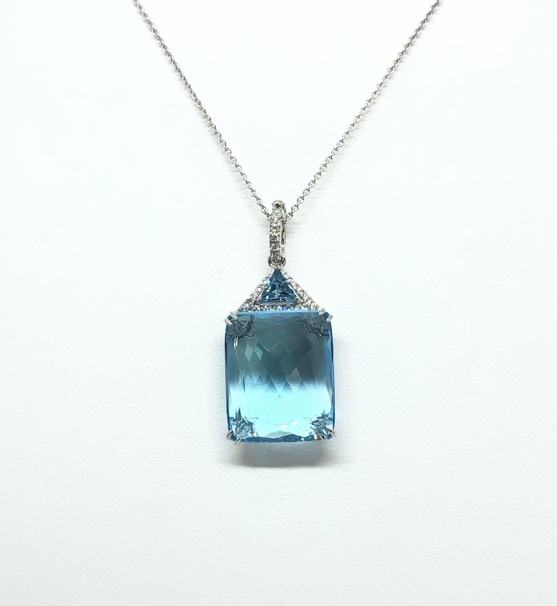 Contemporary Blue Topaz and Diamond Pendant Set in 18 Karat White Gold Settings For Sale