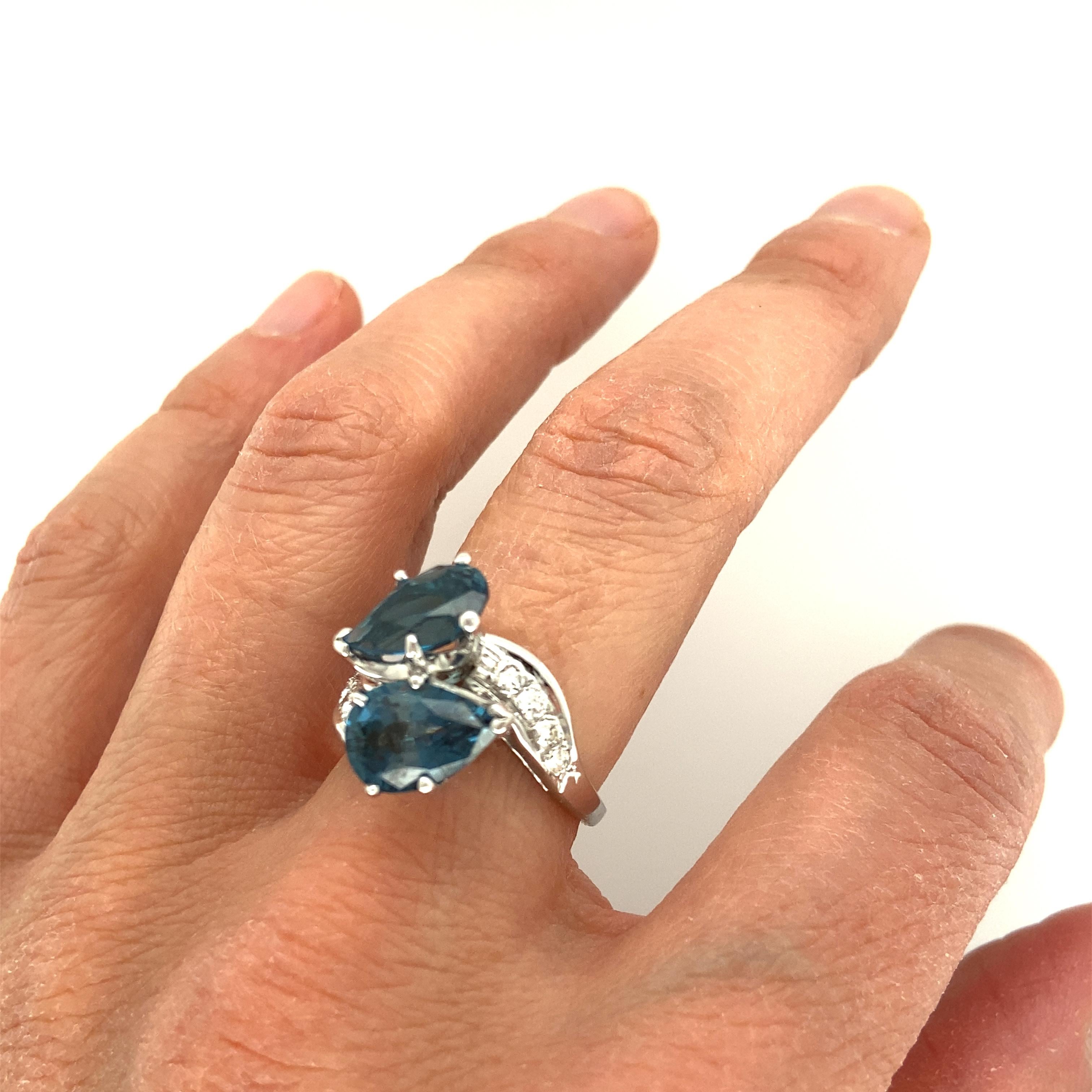 Pear Cut Blue Topaz and Diamond Ring