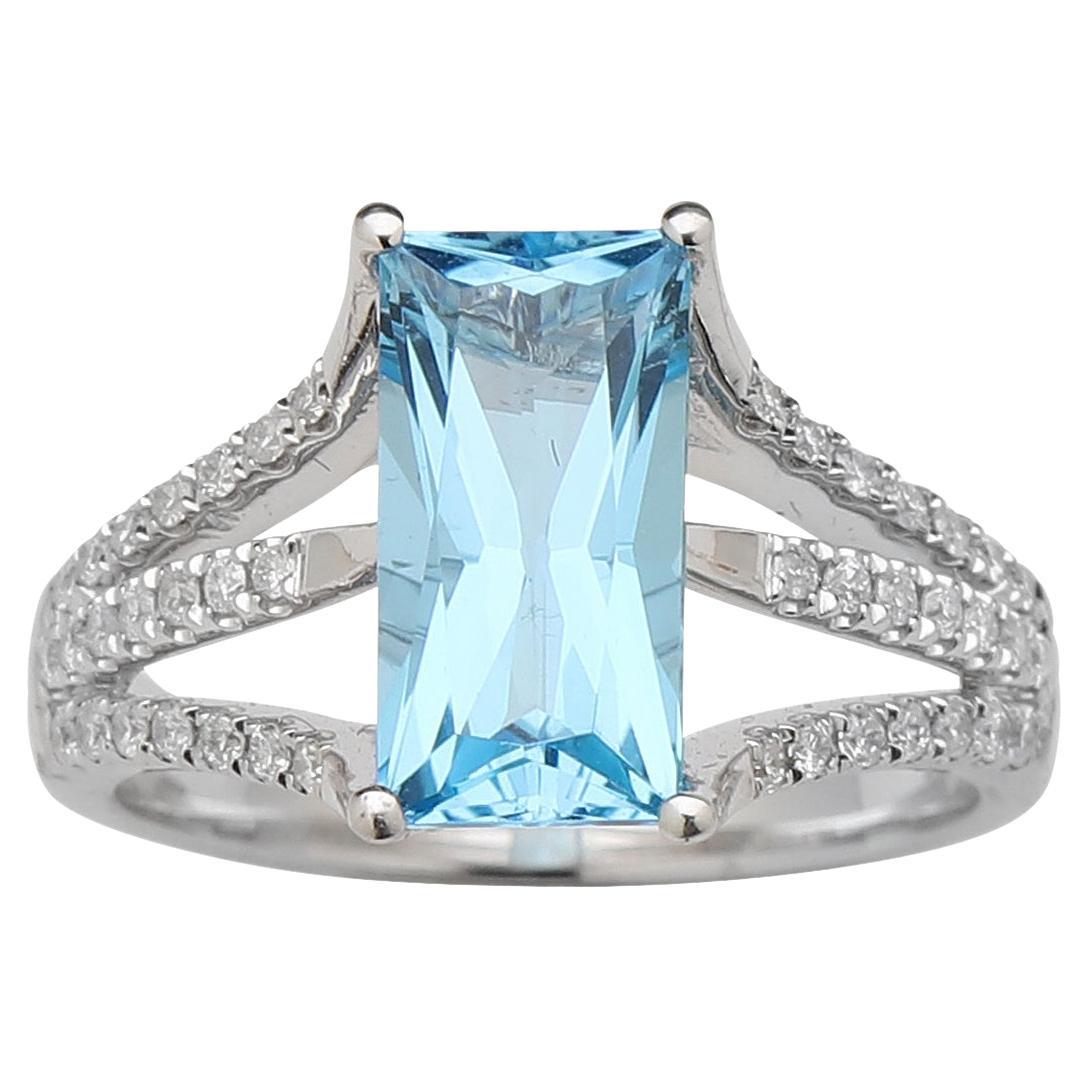 Blue topaz and diamond ring